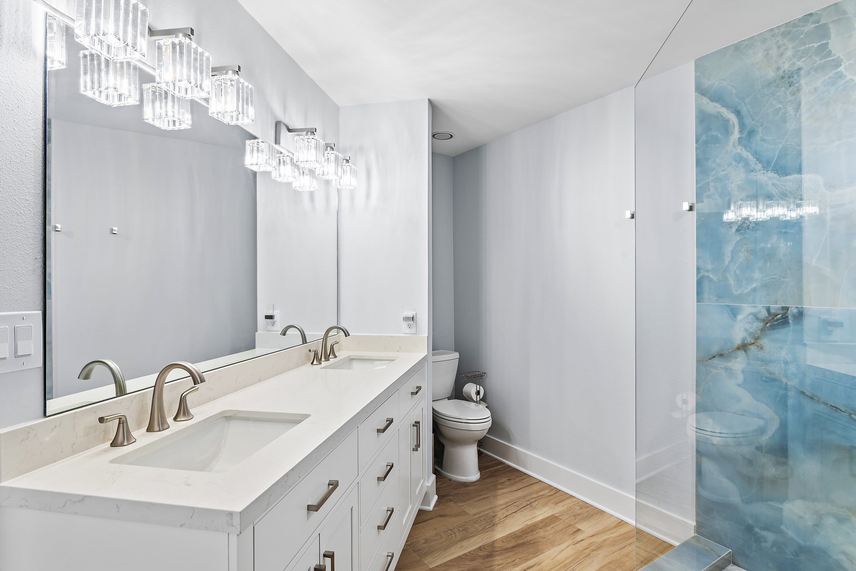Master bathroom with double vanity and walk-in shower