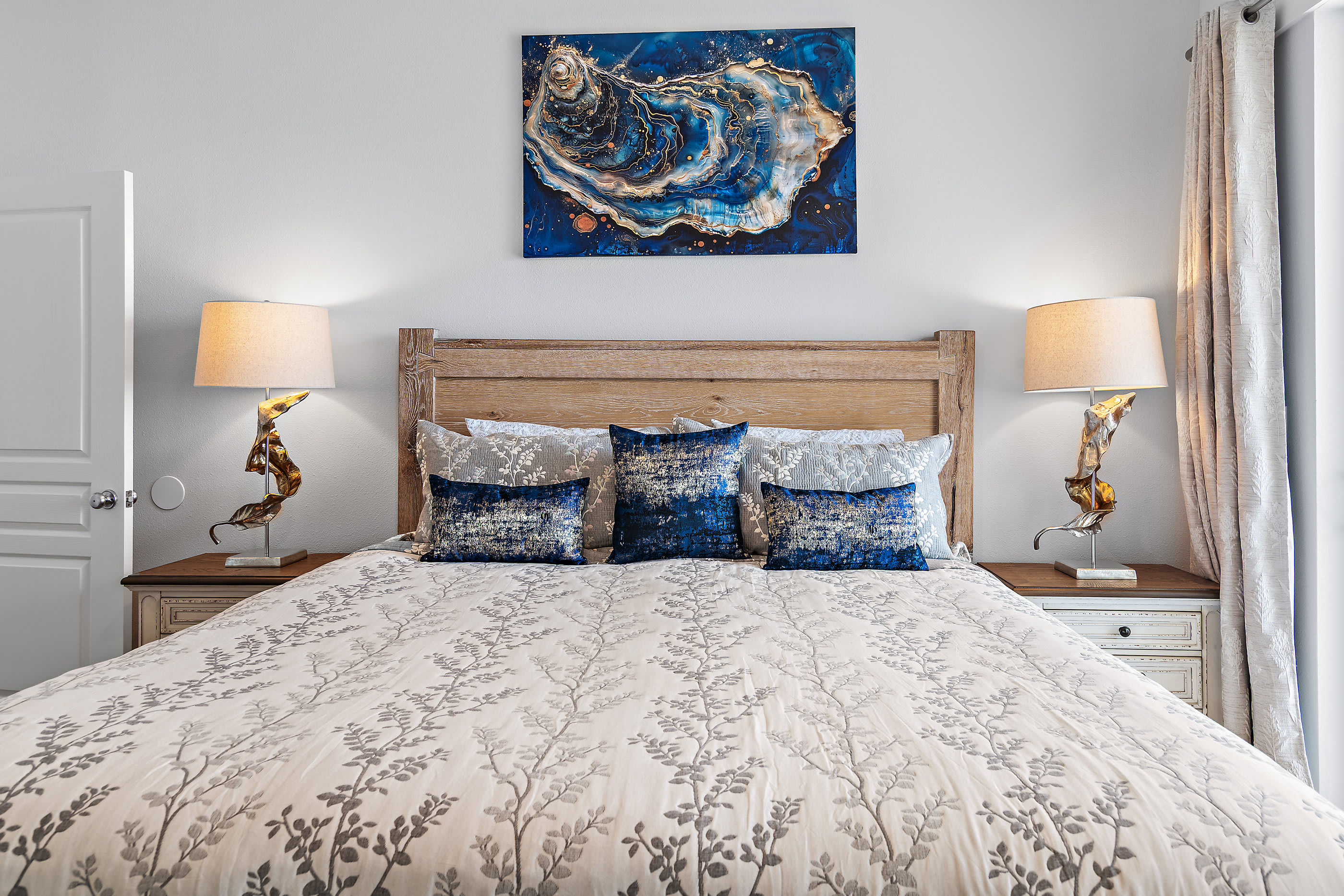 Master bedroom with king bed and balcony access