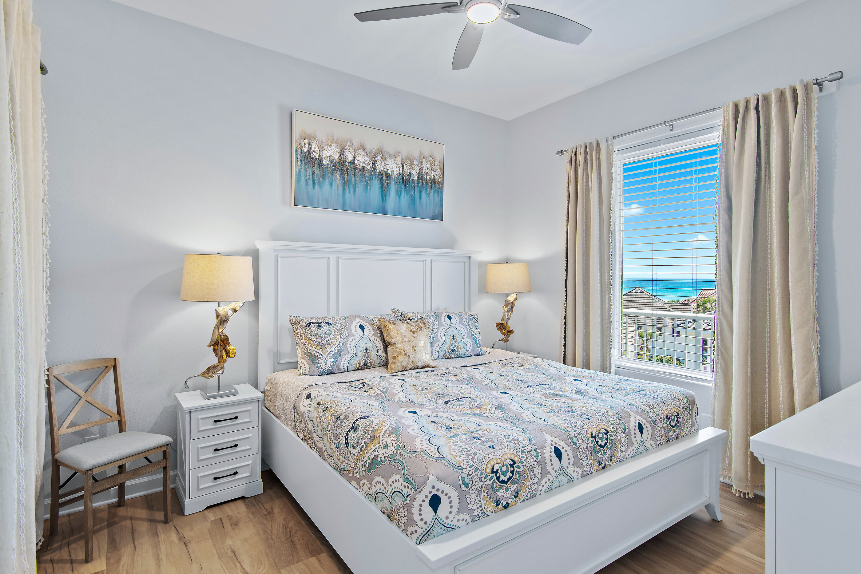 Guest king bedroom alternate view with nightstand and lamp