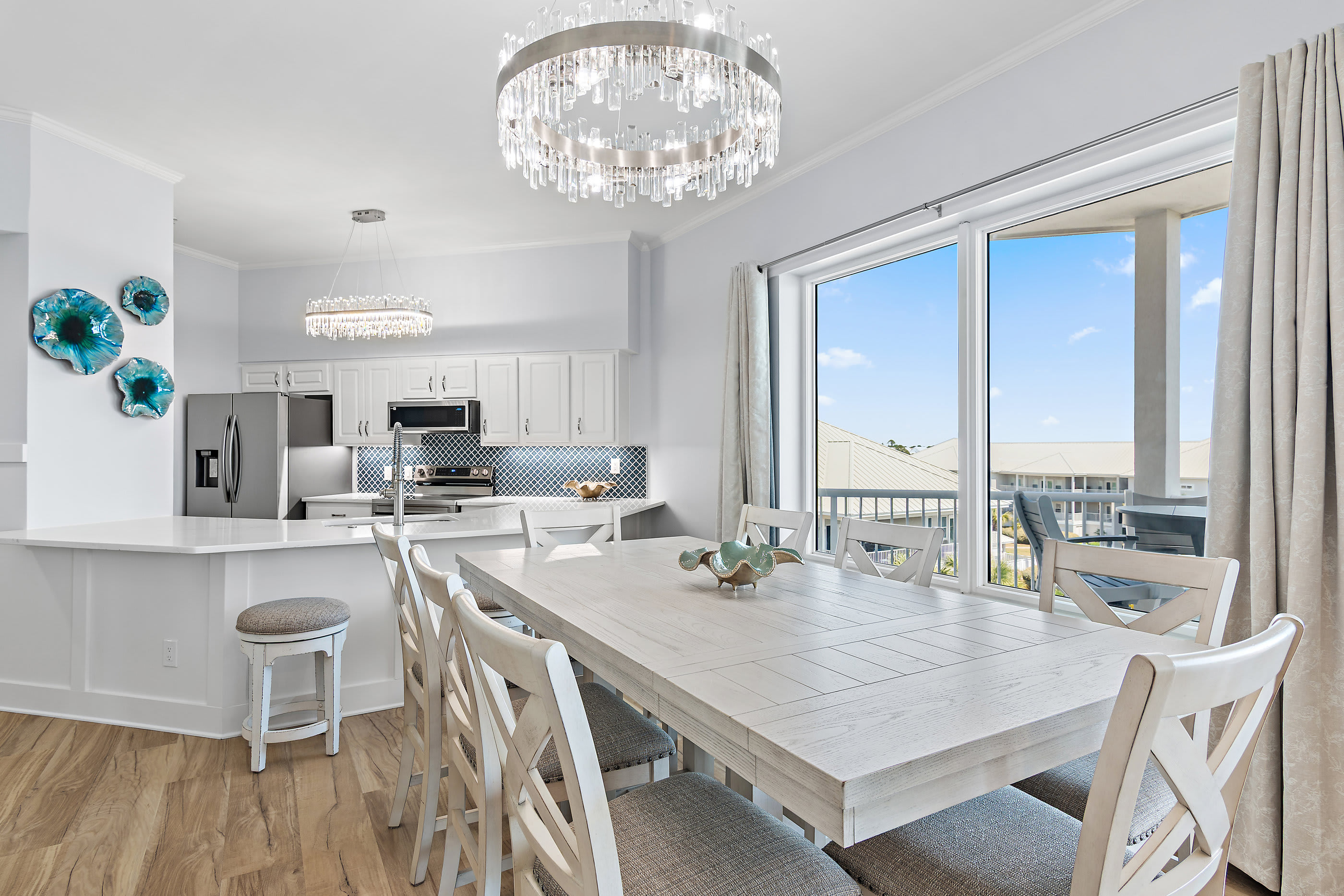Dining area with seating for eight and coastal chandelier