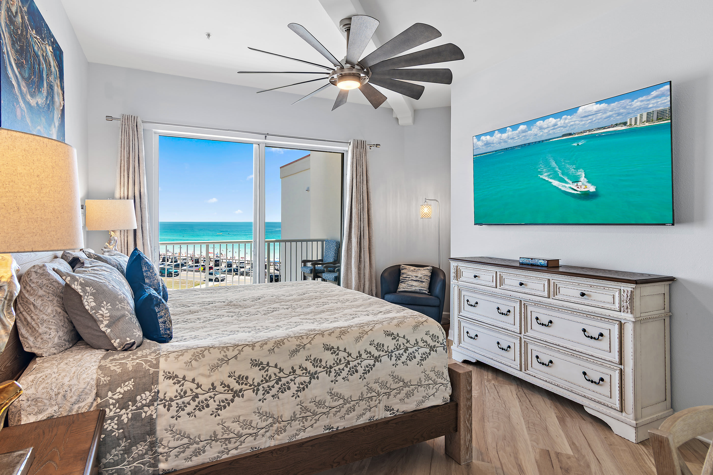 Master bedroom with king bed and balcony access