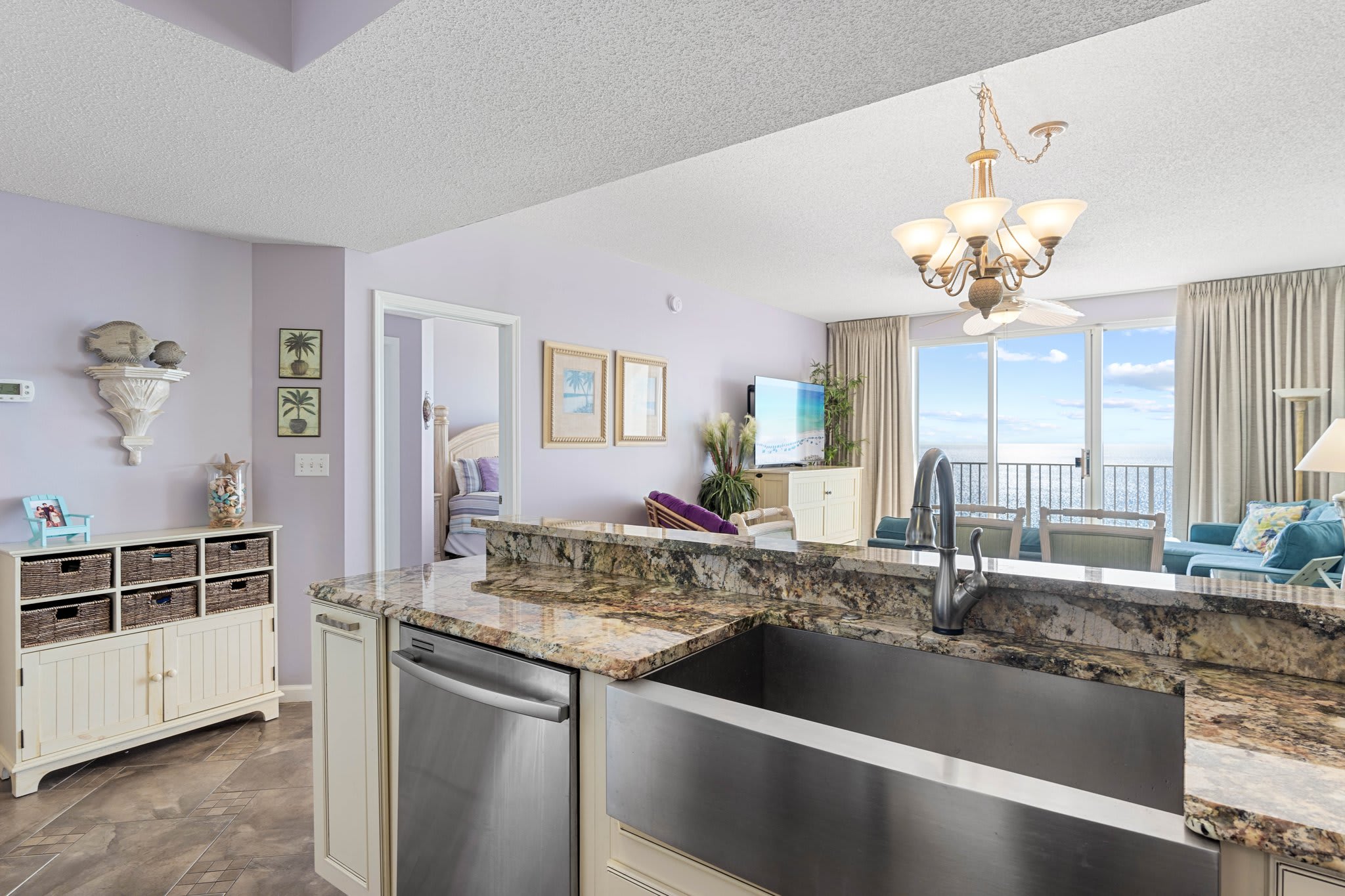 Wide-angle look at the main living space connecting kitchen & seating areas. Wide-angle look at the main living space connecting kitchen & seating areas.