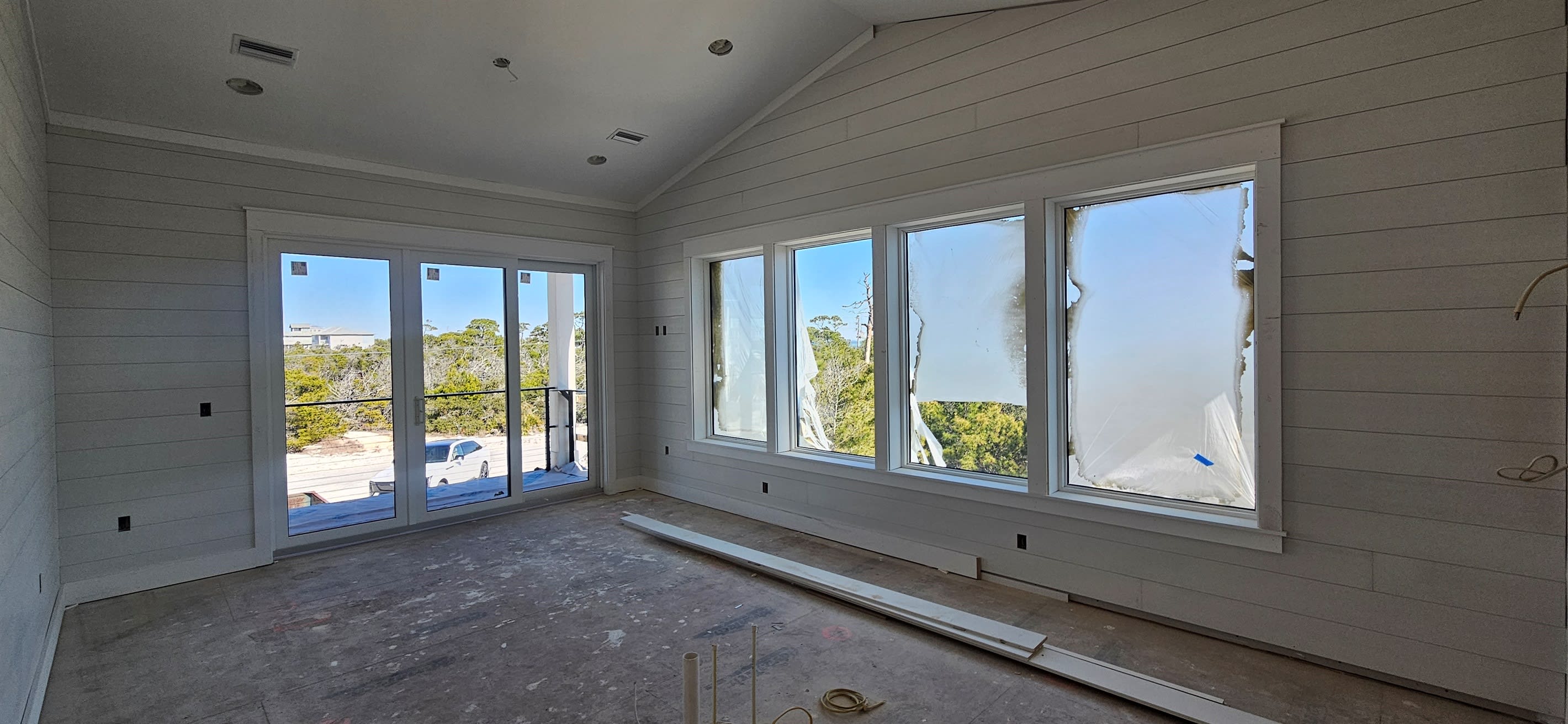 Living Room with Balcony & Bay Views, sleeper sofa, oversized chair, TV & streaming music.