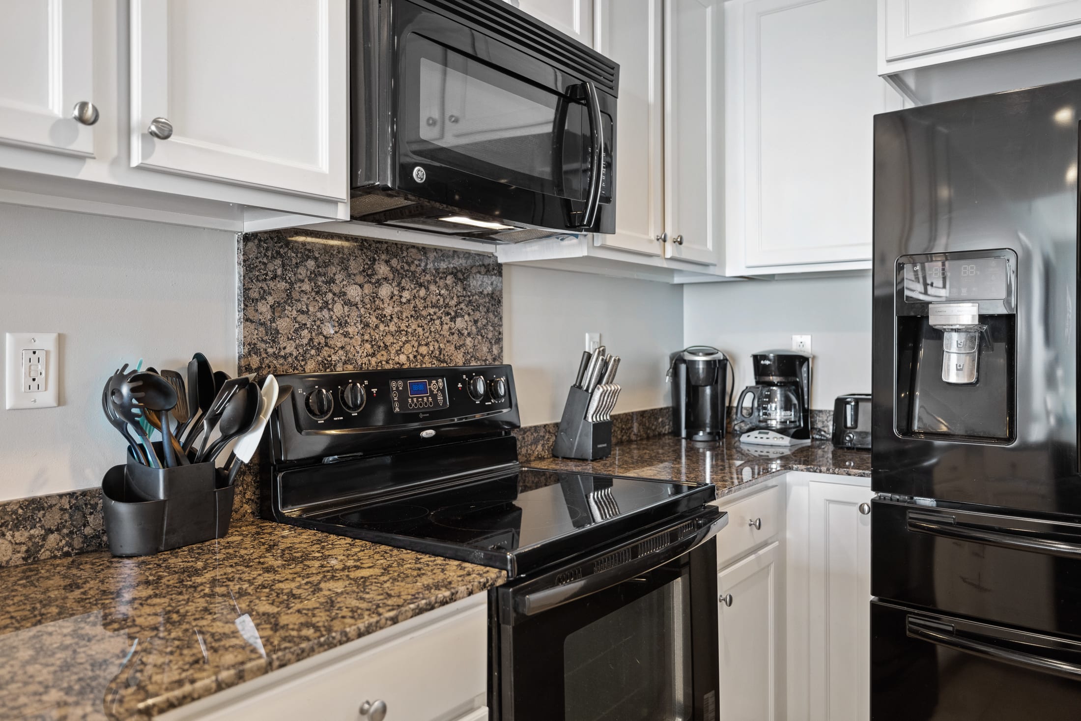 The kitchen is well-equipped with everything you need, including a Keurig and regular coffee pot.