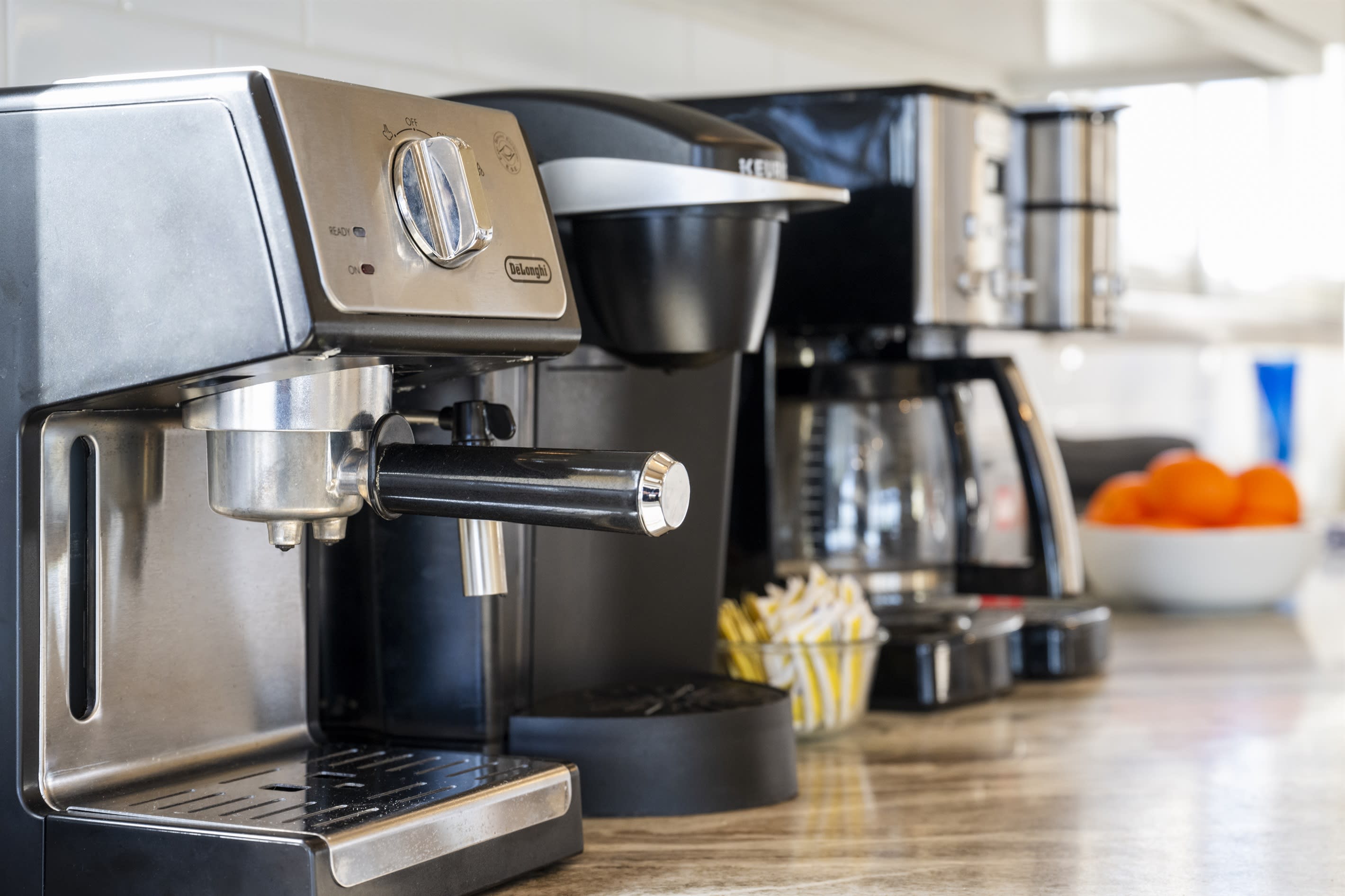 Espresso machine with ESE pods, regular coffee pot, and a Keurig.