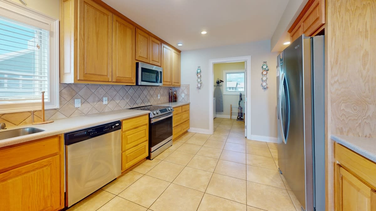 Kitchen with door to laundry room