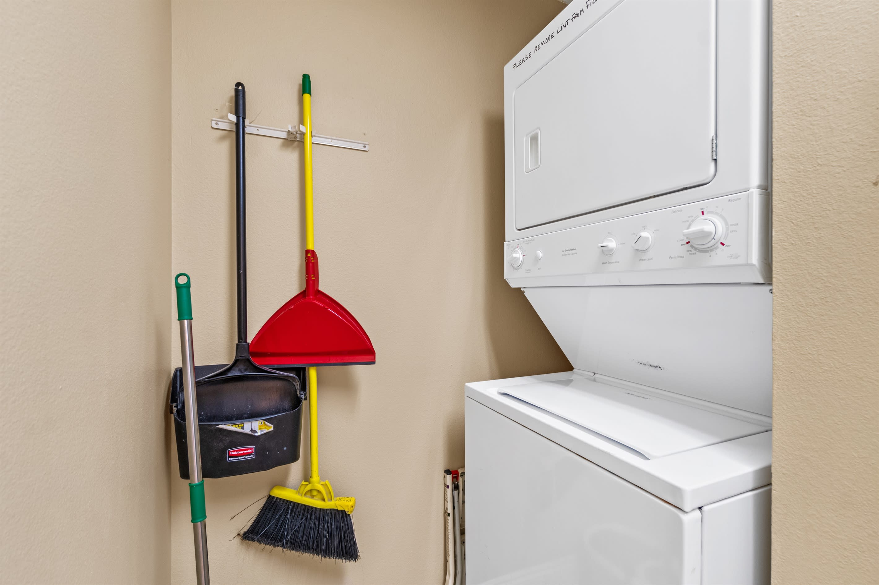 Laundry room with double stacked  washer and dryer