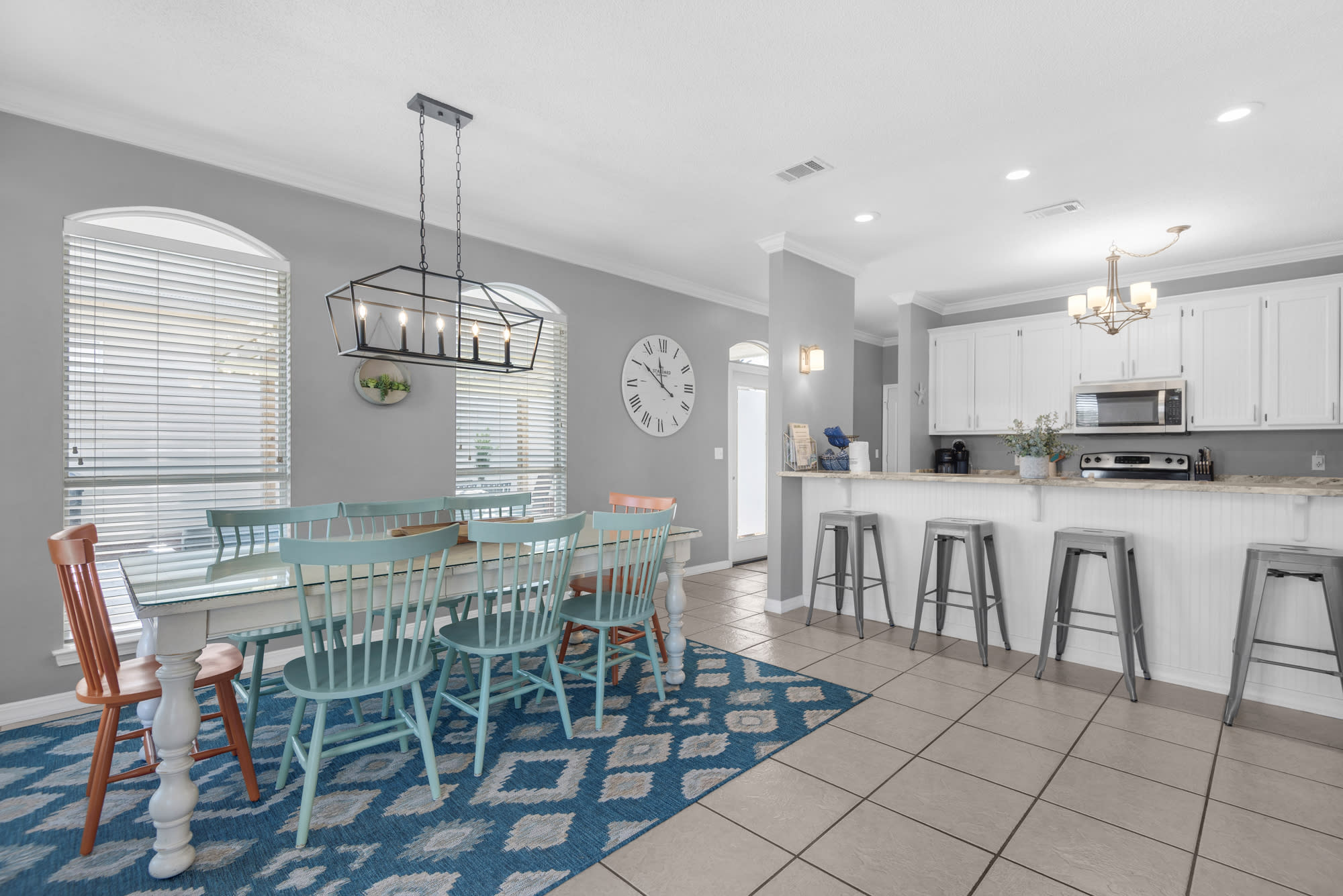 Dining table seats 8 with 4 additional seats at breakfast bar