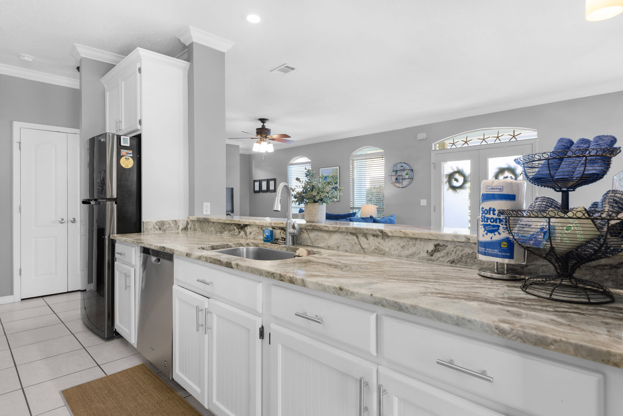 Galley kitchen is open to livingroom/dining area