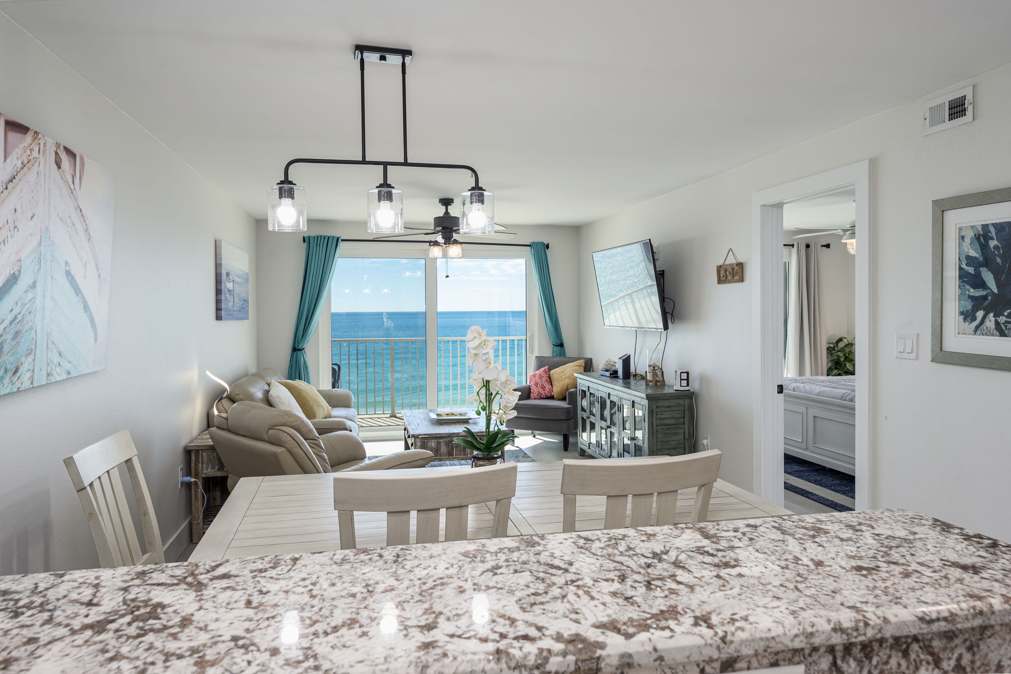 "Gather together in this open-concept space where the kitchen meets the dining and living areas, all with stunning Gulf views. ?????? #CoastalLiving #FamilyTimeByTheSea"