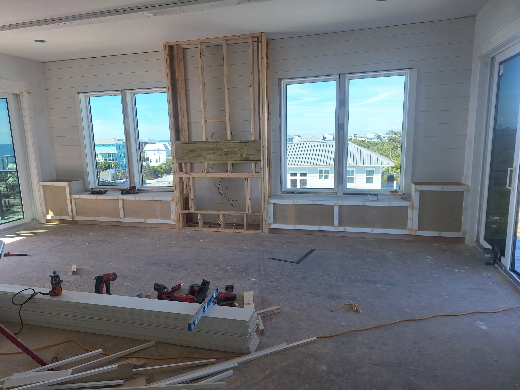 Living Room with built in benches & electric fireplace