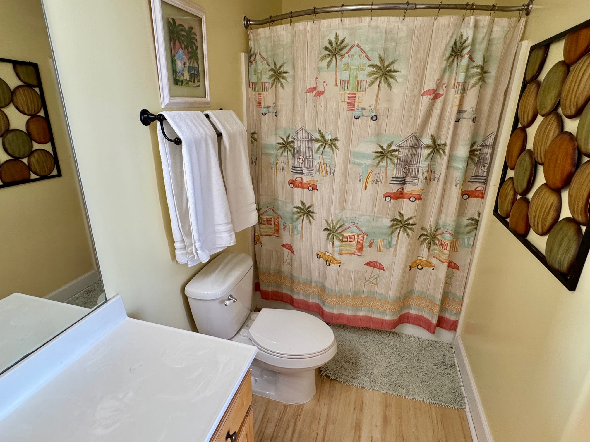 Primary Bathroom with curved shower curtain.