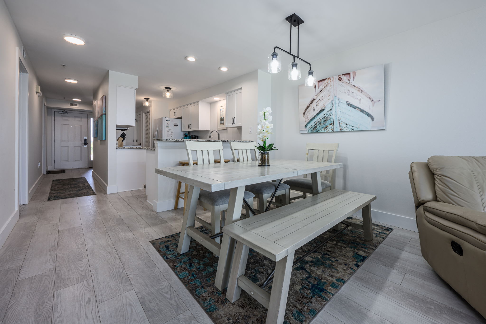 "Dine with a view! This open-concept space effortlessly flows into the living room and balcony, showcasing endless Gulf waters. ????? #OceanfrontDining #CoastalLiving"
