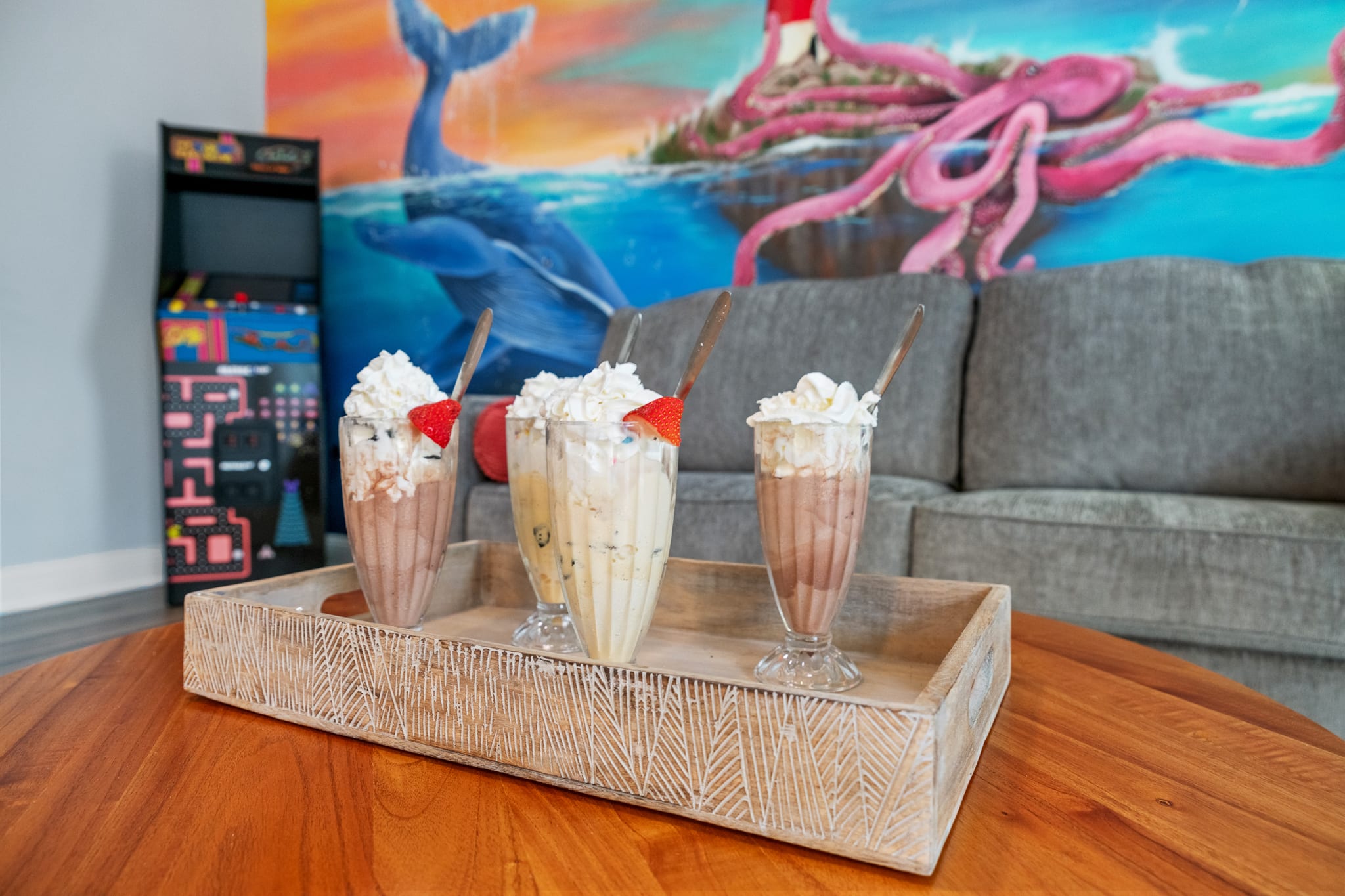 Hang out in the upstairs living room with a 50" SmartTV, arcade game, & kitchenette with milkshake bar