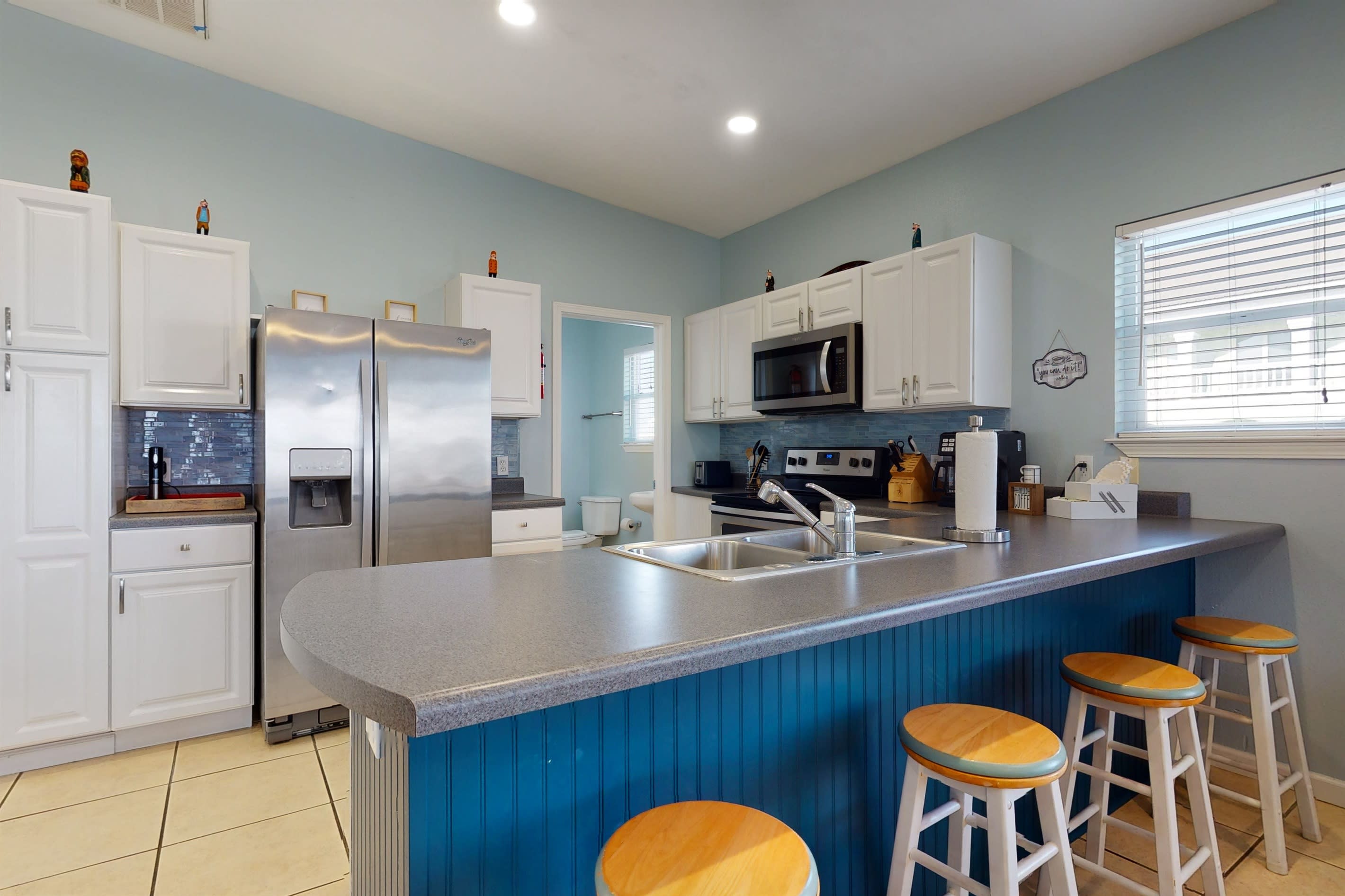 Extra seating at the kitchen island and fully stocked kitchen