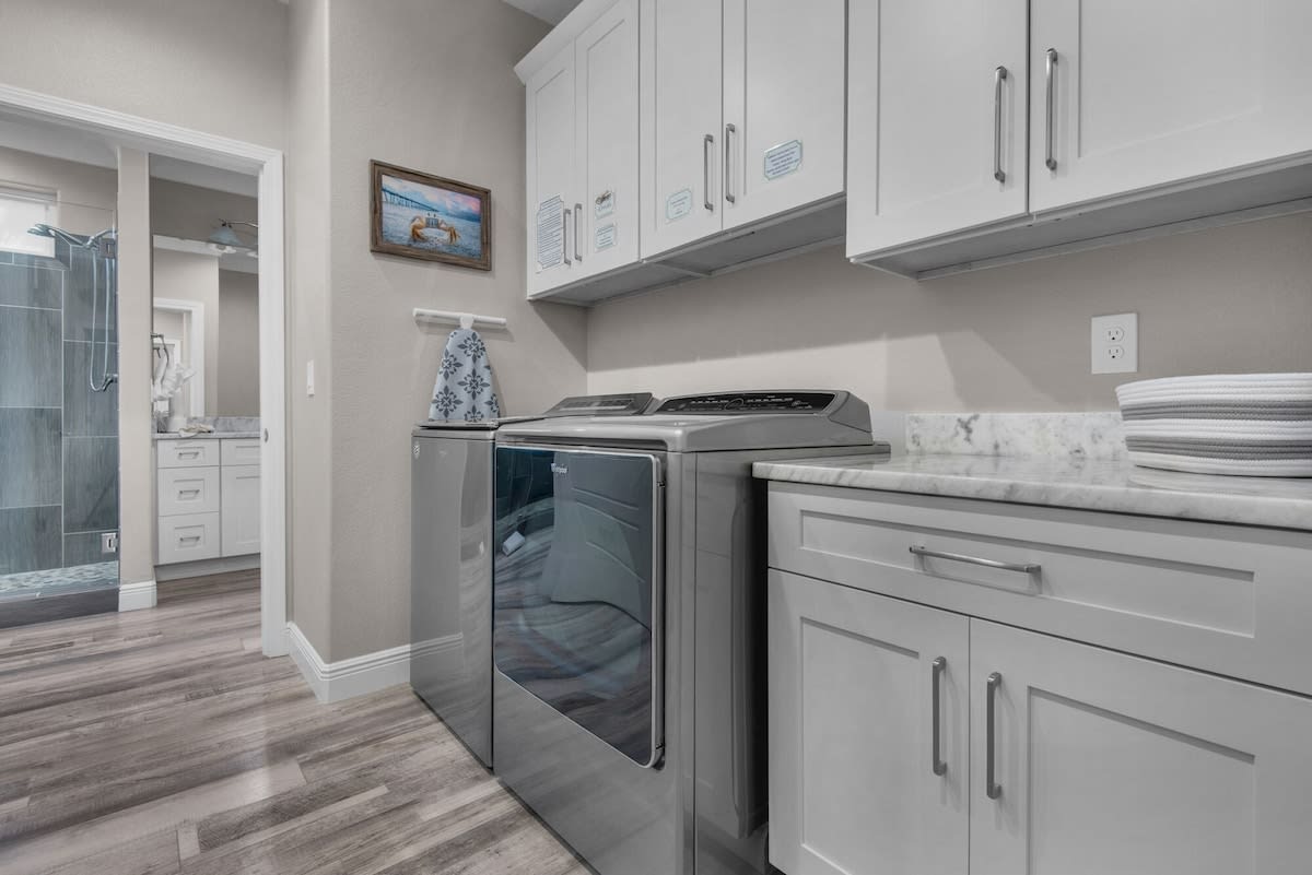 Laundry is a Breeze with Your Full-Size Washer & Dryer & a Spacious Laundry Room
