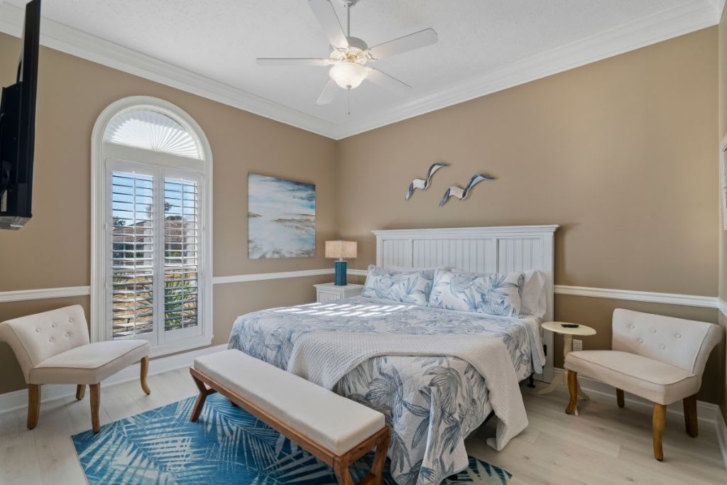 2nd Master Bedroom Features a King Bed with Large French Window & Extra Seating