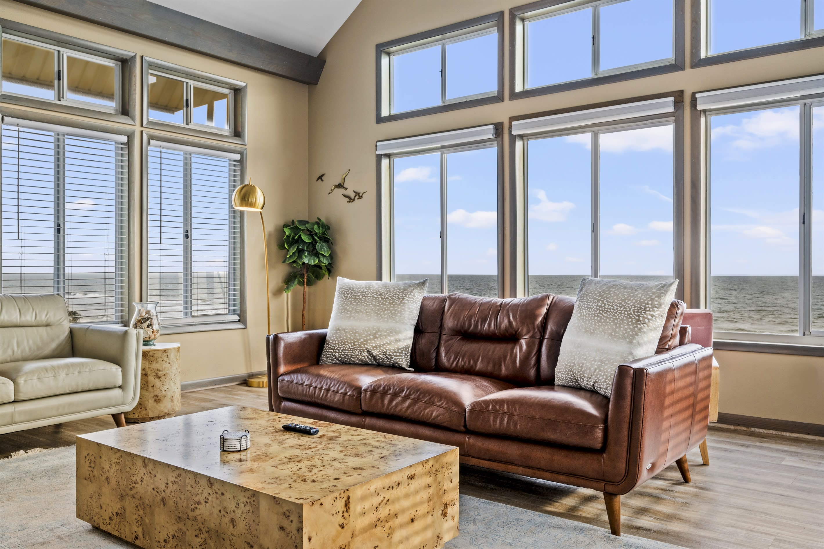 Unforgettable moments await in this spacious living room with panoramic sea views. The eclectic coastal and luxury design, is the perfect space to entertain a large group of friends.