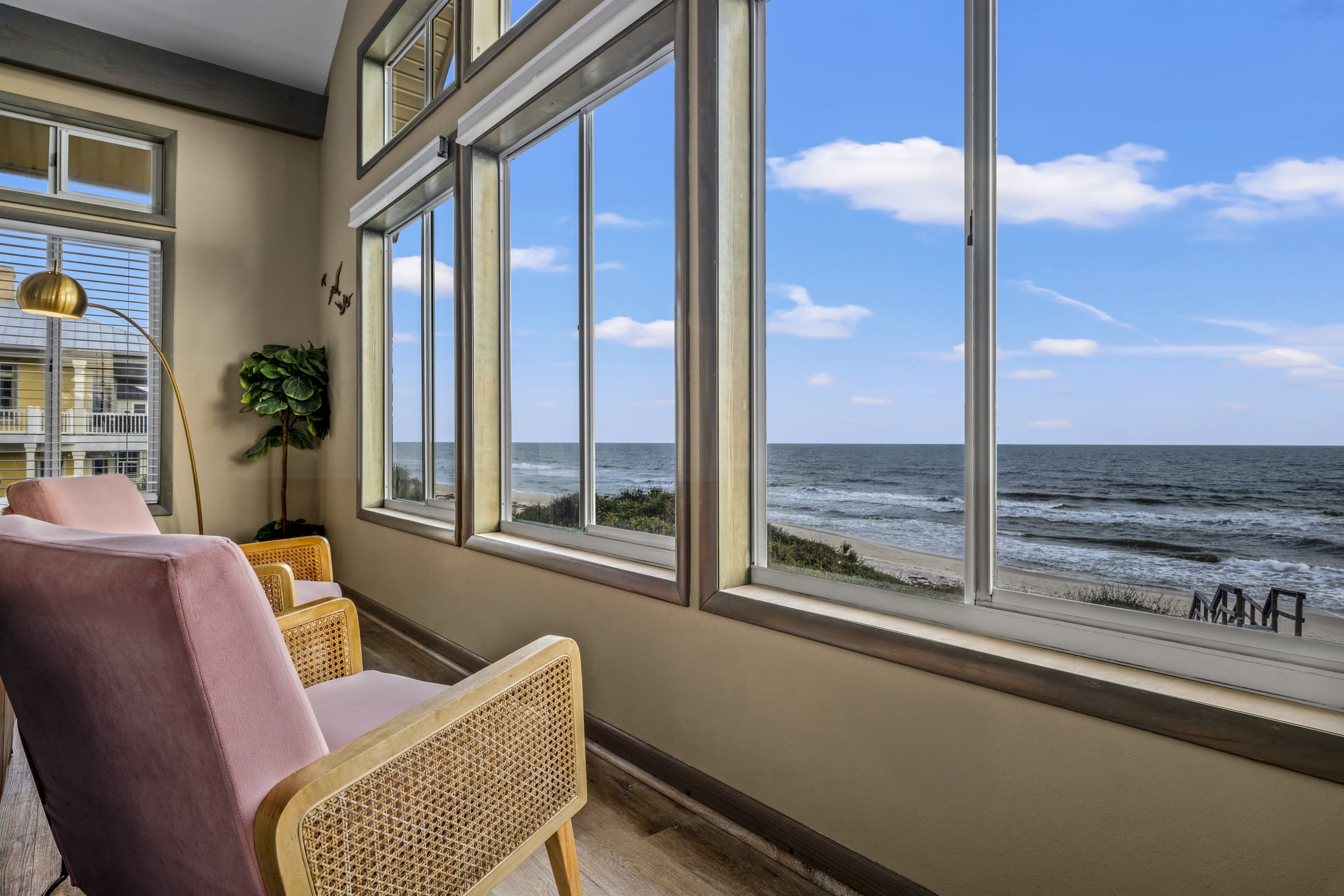 This tranquil living room mixes modern comforts with rustic decorative items, lovely antique wood furniture, comfortable seating and a warm, neutral palette of beiges and bronzes that is easy