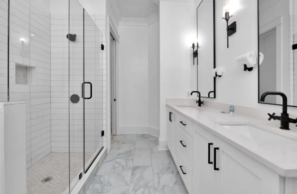 Ensuite bathroom with two sinks and walk in shower