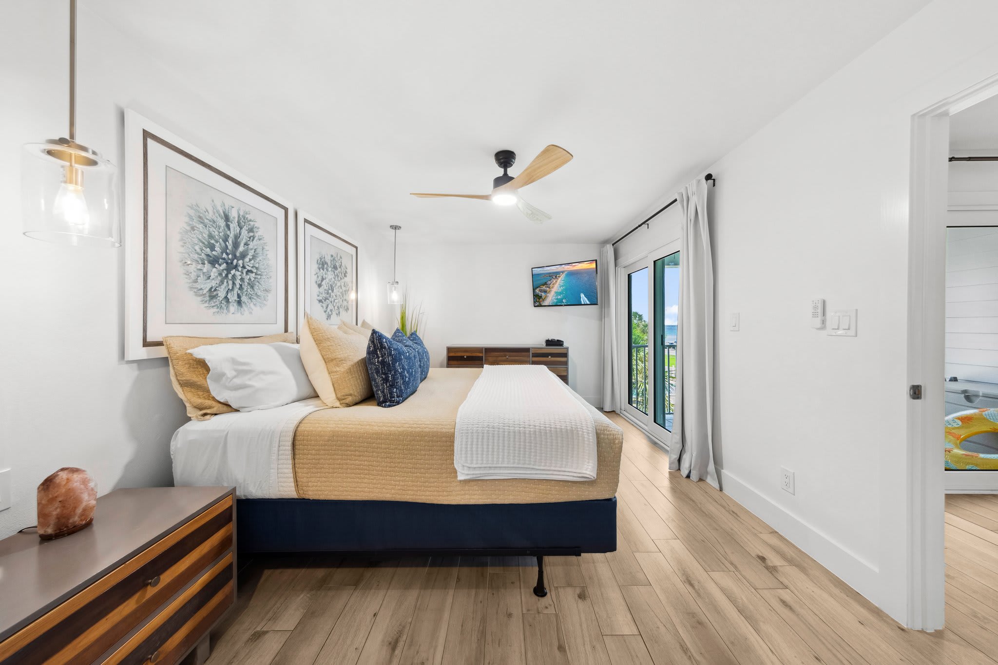 Primary suite with comfortable king mattress, TV and view of the Gulf of Mexico