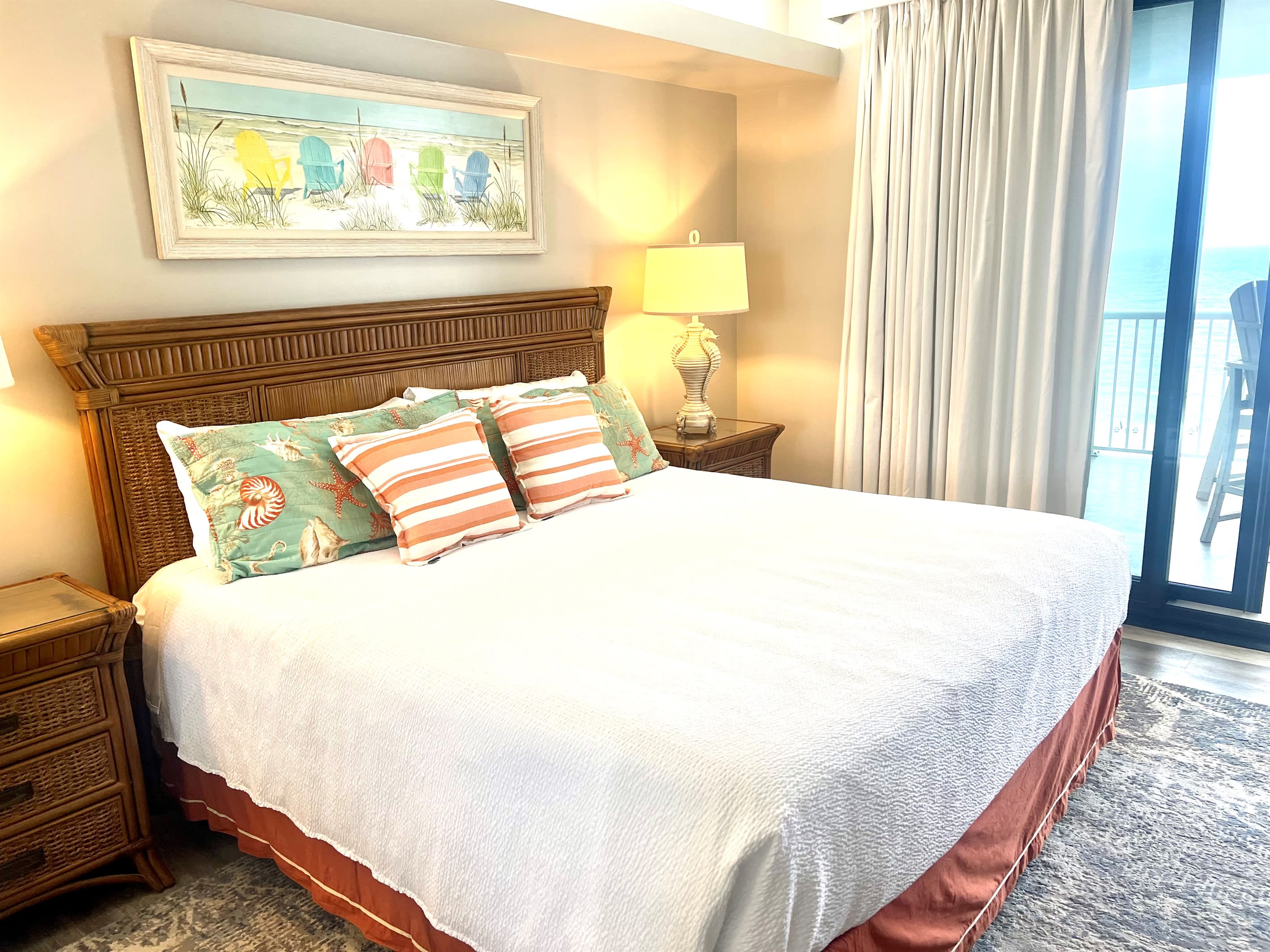 Primary bedroom steps out to balcony. 