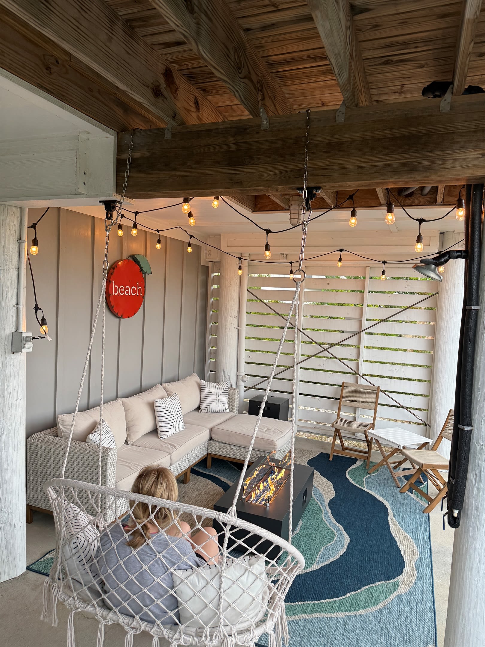 Relax with your family on cooler nights by the firepit on the patio.  You’ll sink into the wonderful sofa or enjoy snuggling into the hammock swing while the sounds of the nearby wetlands nature soothe you and your fresh catch cooks on the grill here!