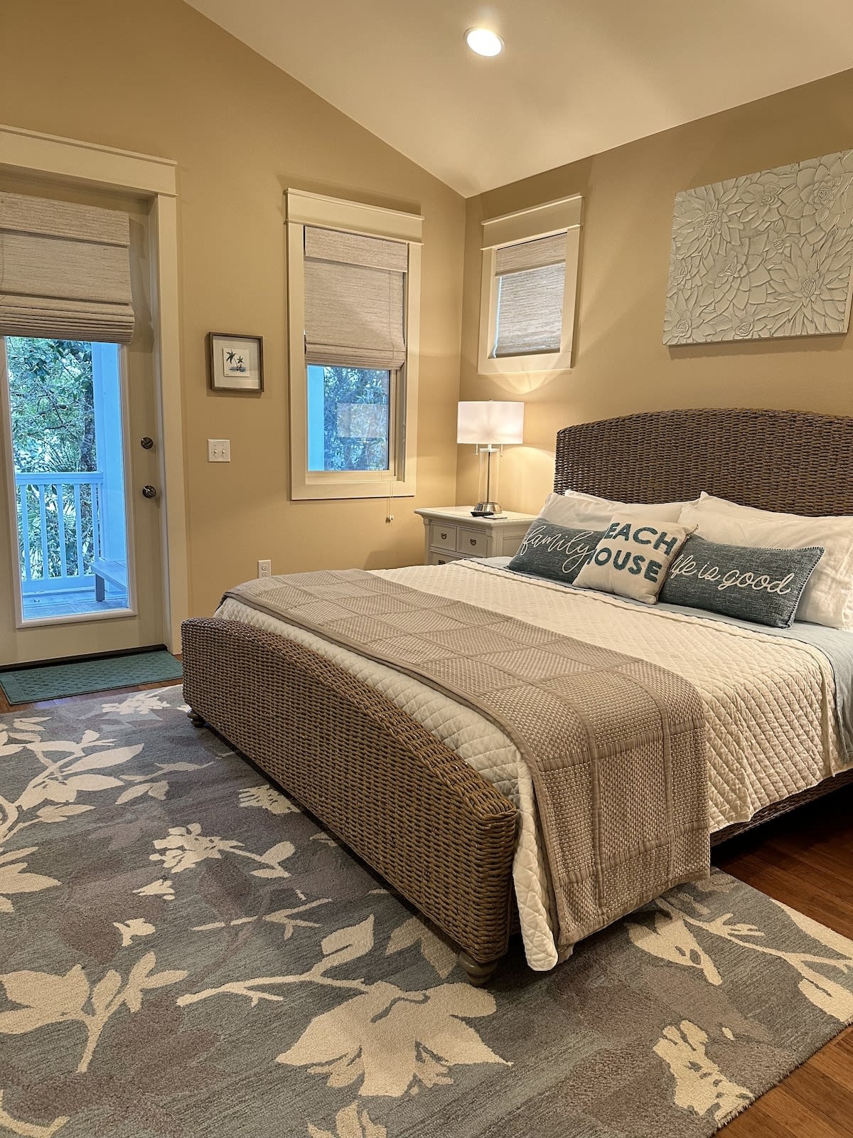 Master bedroom #1 KING seagrass bed w door leading to private treetop porch.