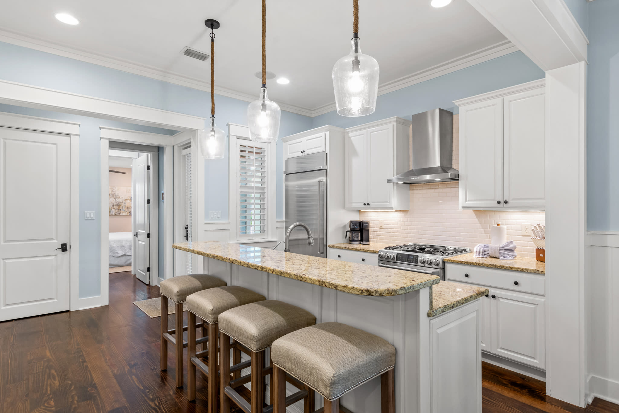 Bright kitchen w/ granite island, bar seating & pendant lights—great for cooking and gathering. Bright kitchen w/ granite island, bar seating & pendant lights—great for cooking and gathering.