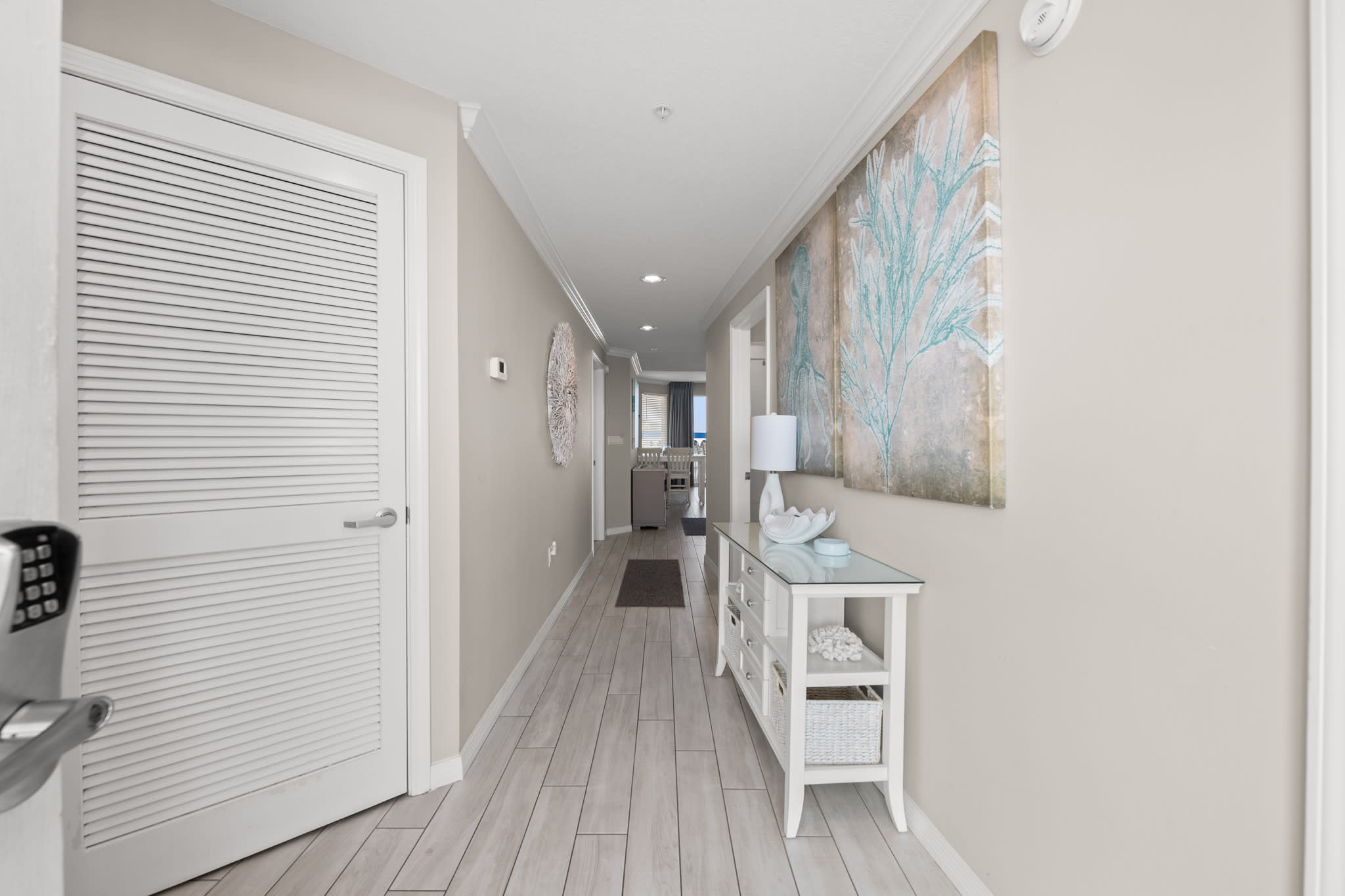 Clean hallway connecting the spaces with a bright, open feel.