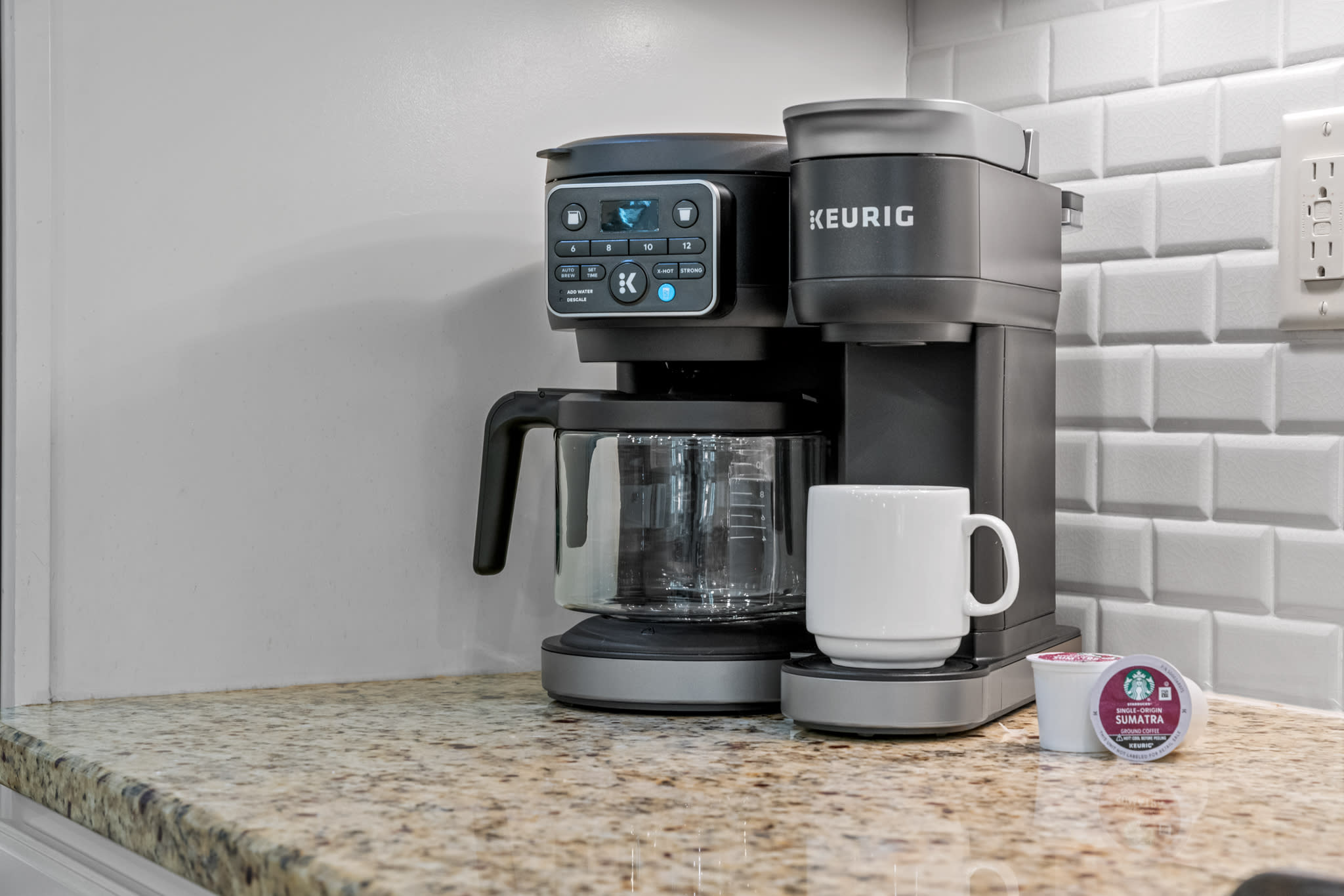 Coffee setup w/ Keurig, mugs & pods ready to jumpstart slow mornings. Coffee setup w/ Keurig, mugs & pods ready to jumpstart slow mornings.