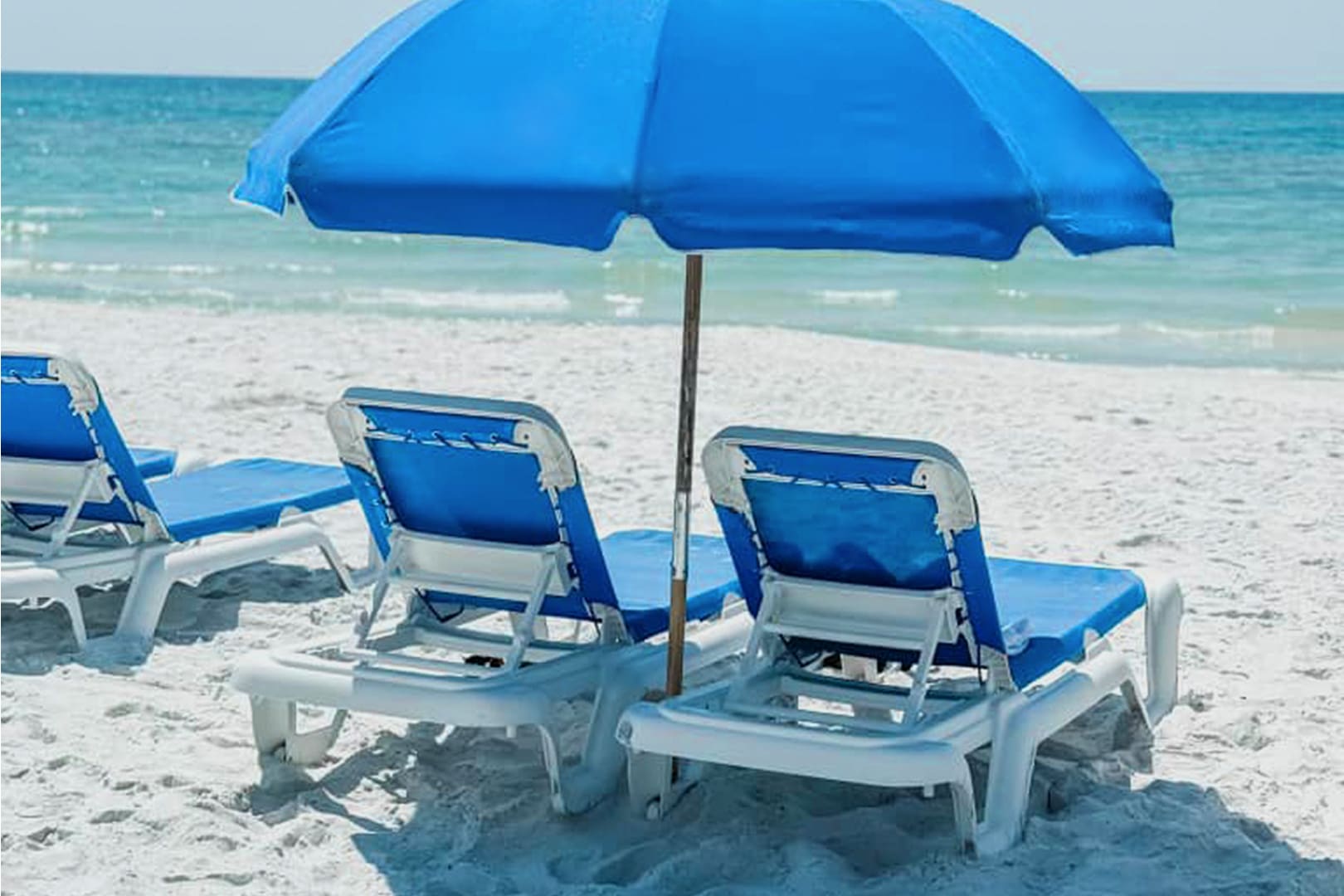 2 Chaise Lounges and a Beach Umbrella Set Up Just for You During Your Stay March–October