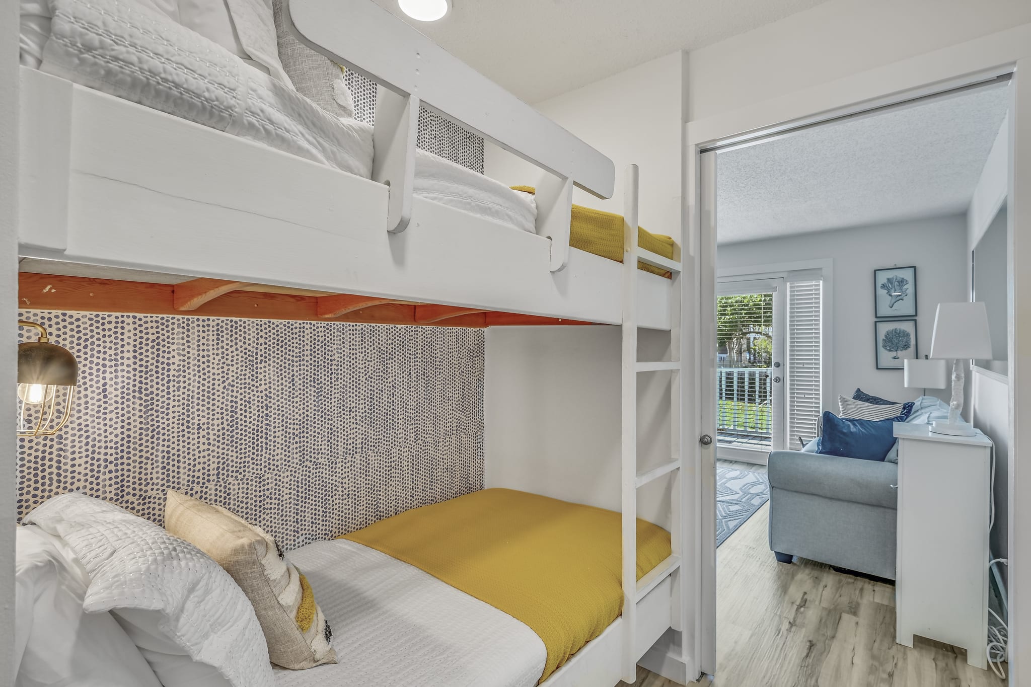 Hallway bunk beds off of the living room. Comfortable bedding, in-wall lighting, easy to use ladder right up to the top bunk. Pocket door for ample privacy and light control.