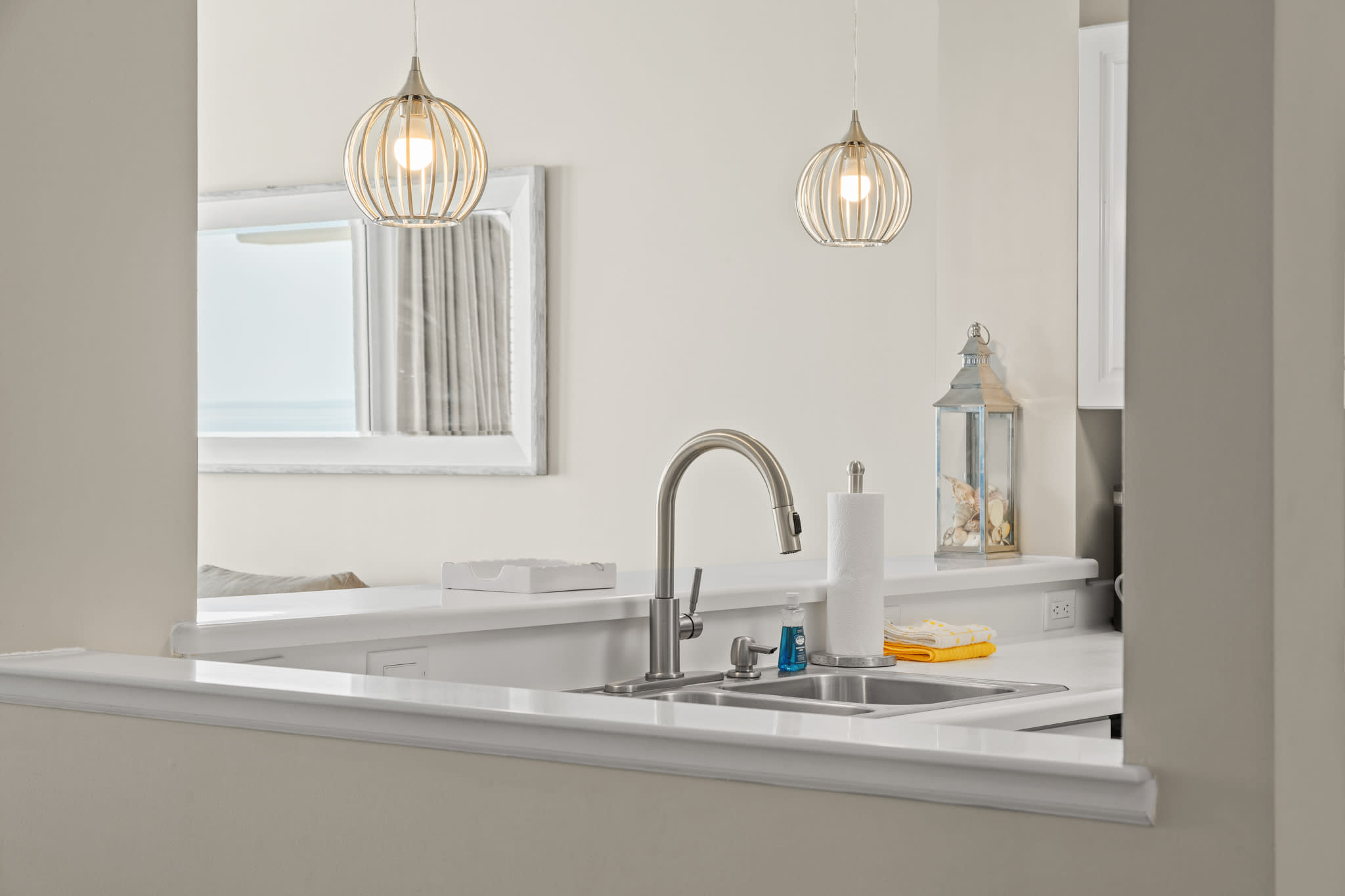 Clean, bright kitchen w/ generous counters and everyday essentials.