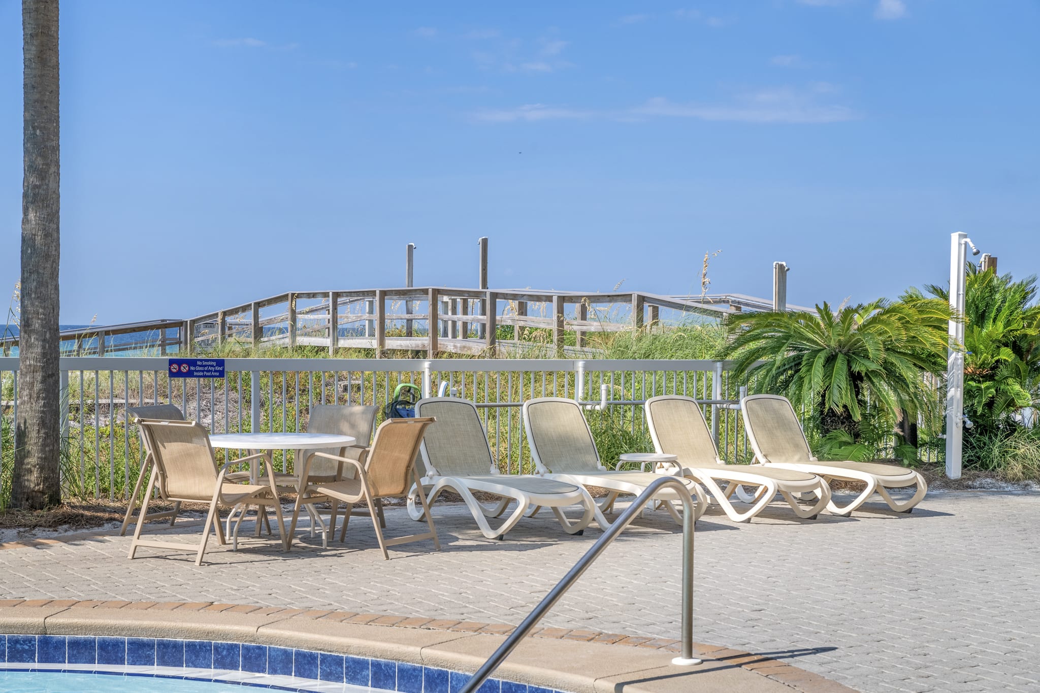 Boardwalk to beach on other side of pool (directly to right of unit)- no stairs!