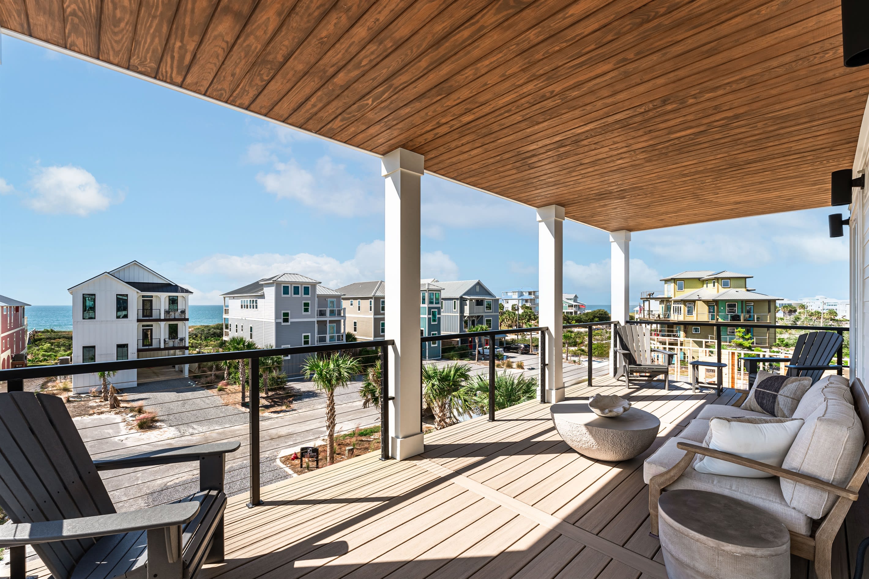 Bedroom Deck over Looking Gulf. Sized couch and 4 Adirondack chairs