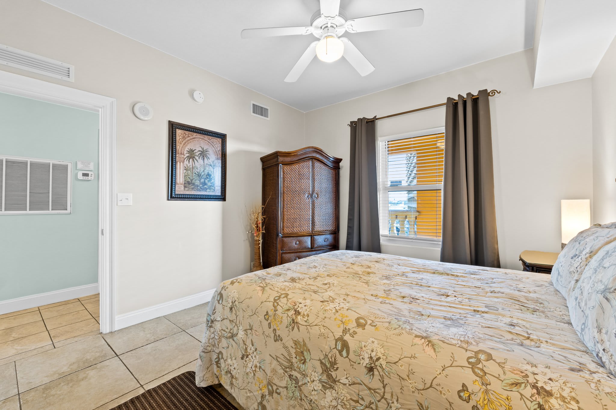 2nd bedroom has a flat screen tv and large armoire