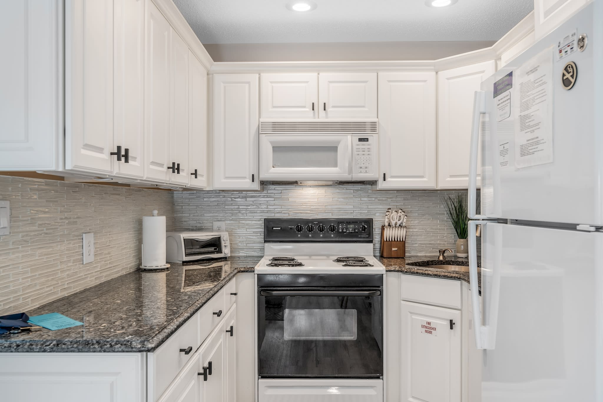 Fully equipped kitchen with modern accents throughout. Ample counter space to easily cook any meal. Kitchen has an oven, stove, microwave, toaster, freezer/fridge combo, Flex Brew coffee maker for gounds or Kureg cups and all necessary cooking utensils. 