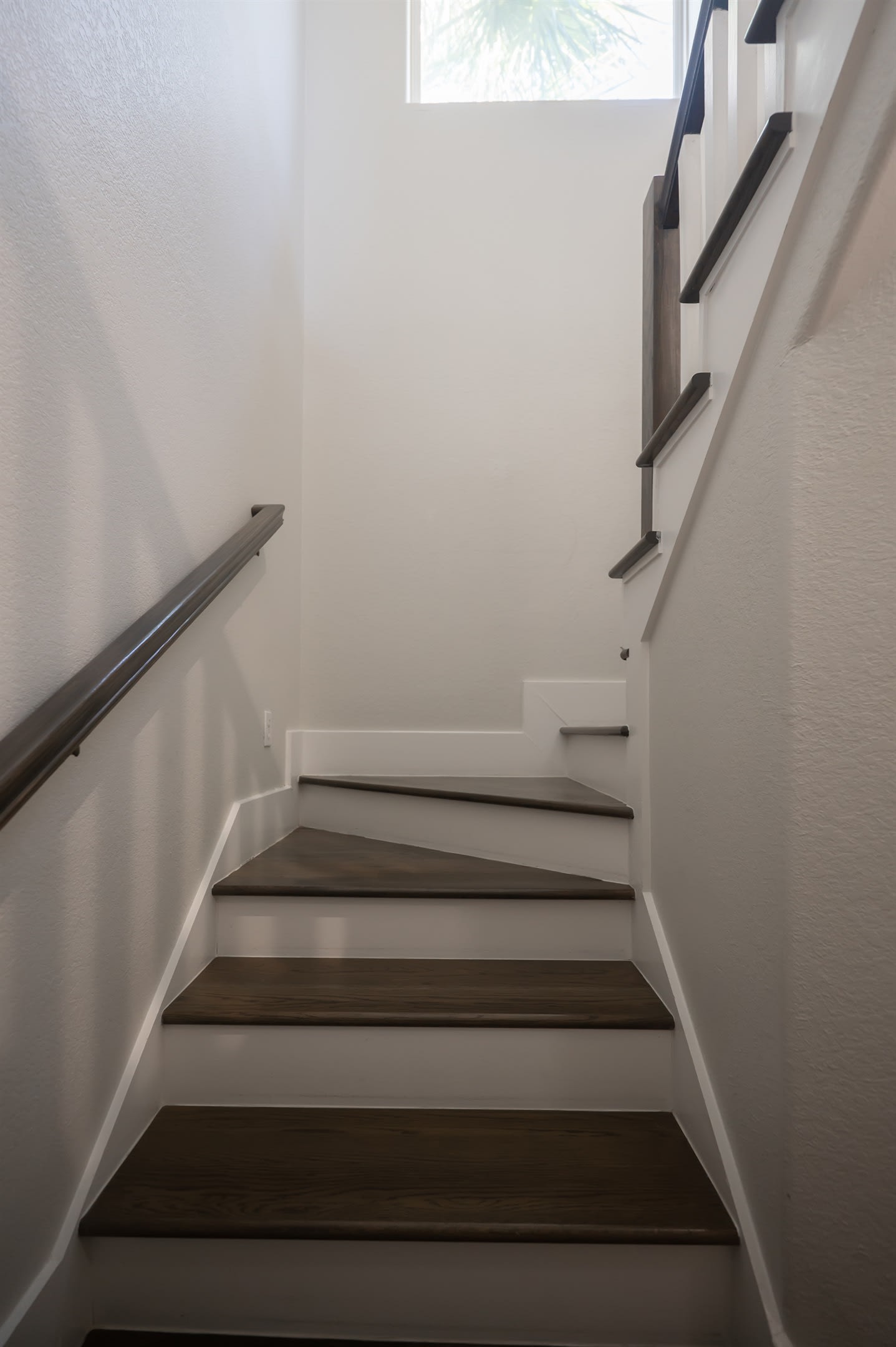 Simple hallway detail creating a clean, uncluttered transition between rooms.