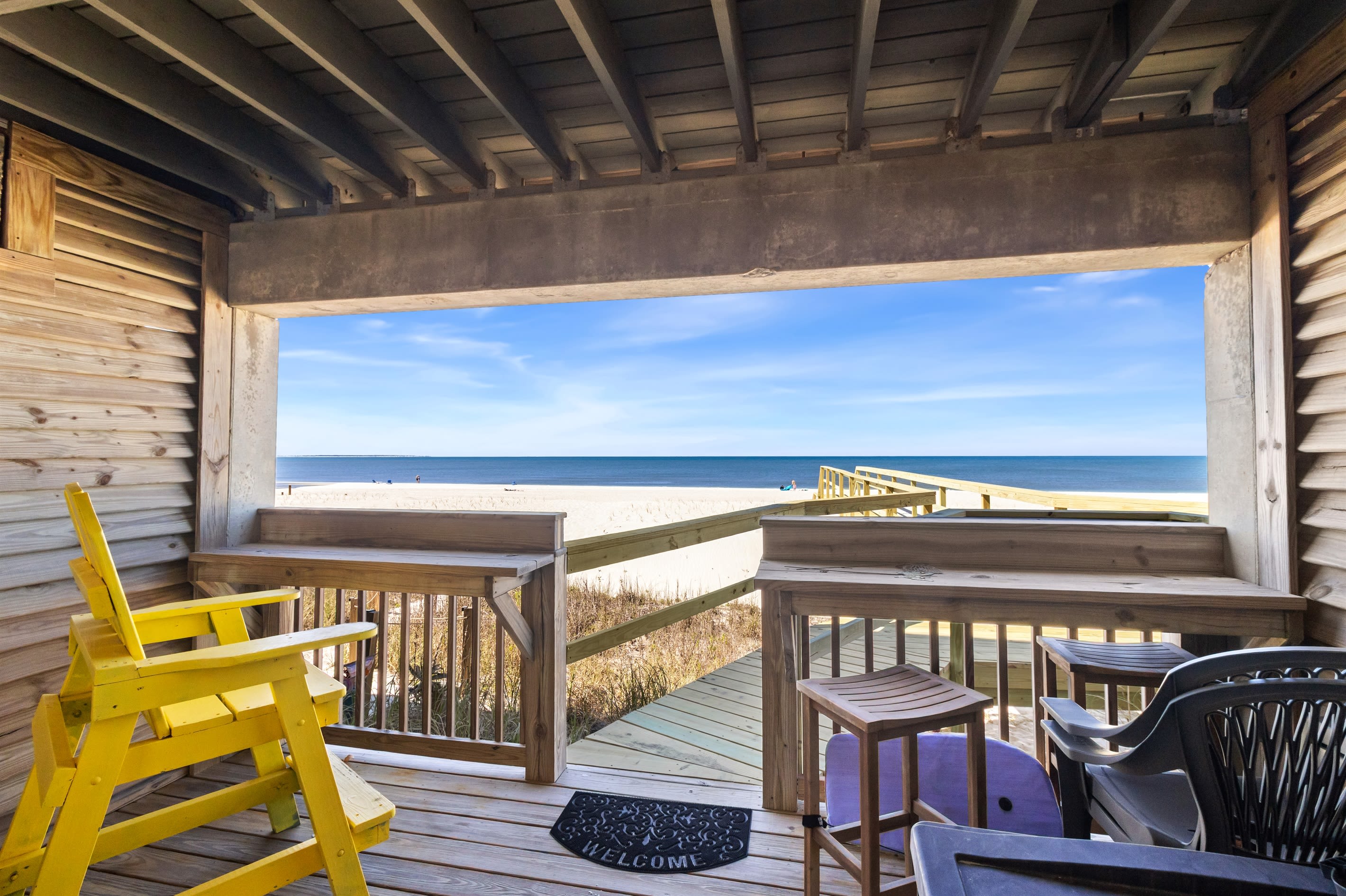 downstairs patio with new boardwalk to the beach