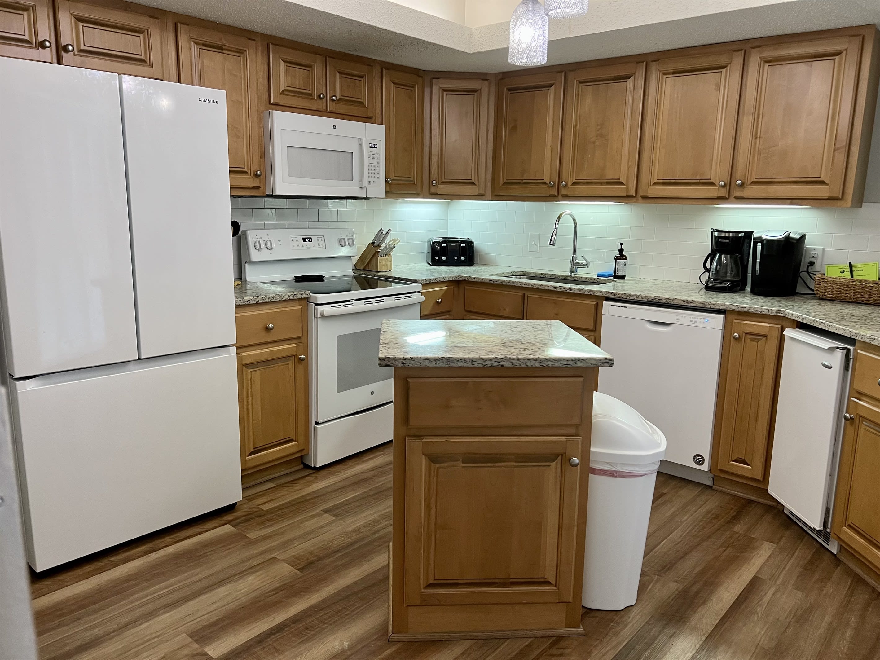 Updated kitchen has new refrigerator with ice maker and all kitchen necessities