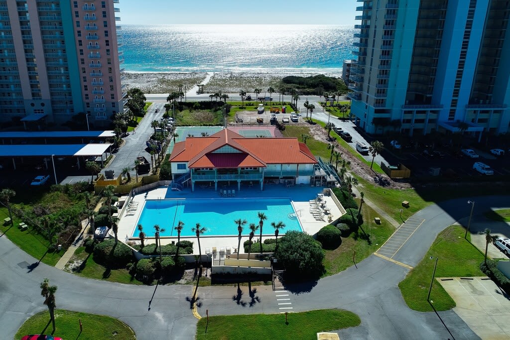 Experience paradise from above - our stunning aerial view captures the grandeur of the largest pool on Pensacola Beach. Immerse yourself in luxury and create lasting memories in this aquatic haven. ????? #PoolPerfection #AerialElegance #BeachsideBliss