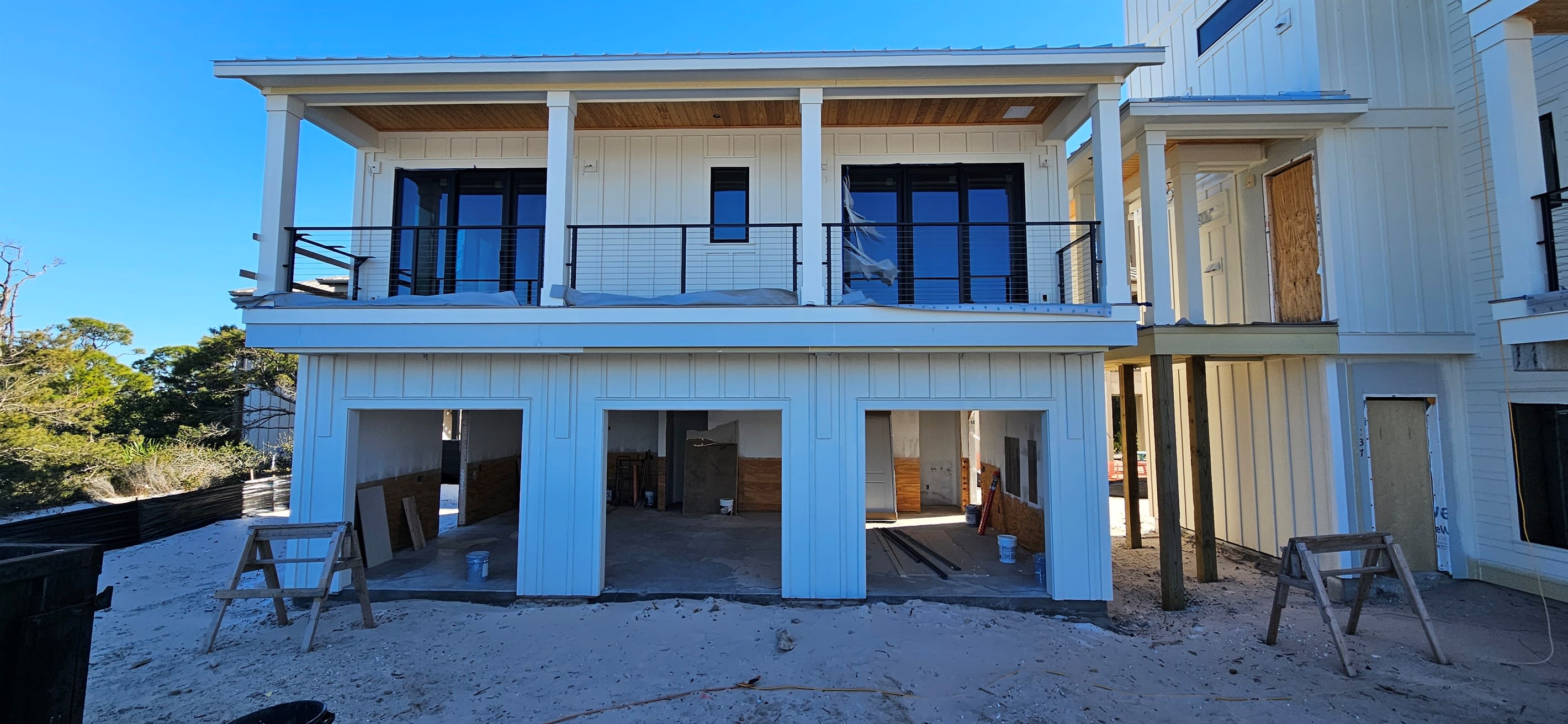 Carriage Exterior. In the garage there will be a bar, pool table, tv, & darts. To the left of the carriage is a firepit patio & Grill. Carriage can be rented separately for smaller groups.