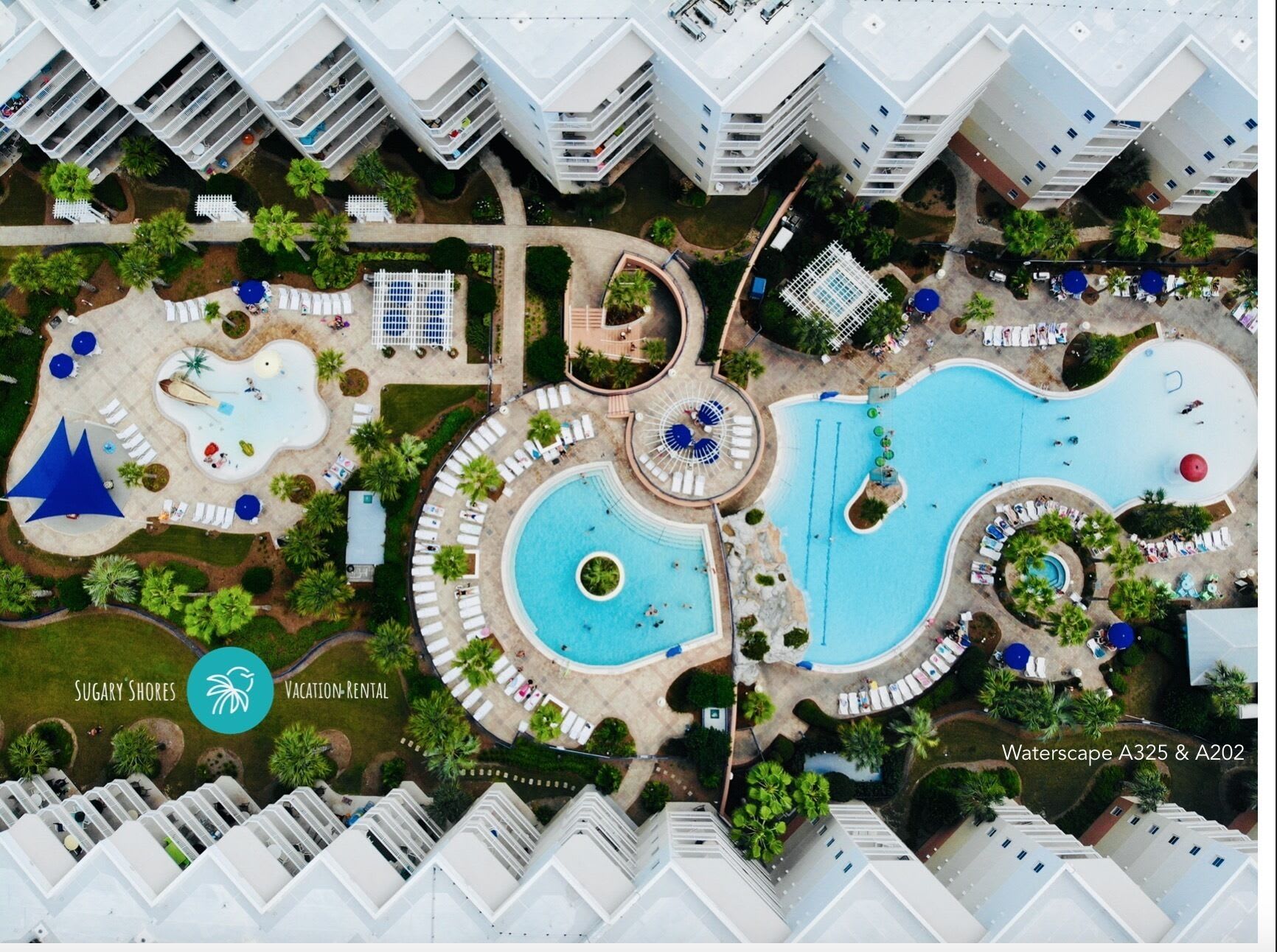 Birds-Eye view of the splash park, heated upper tiered pool, and zero entry pool Birds-Eye view of the splash park, heated upper tiered pool, and zero entry pool