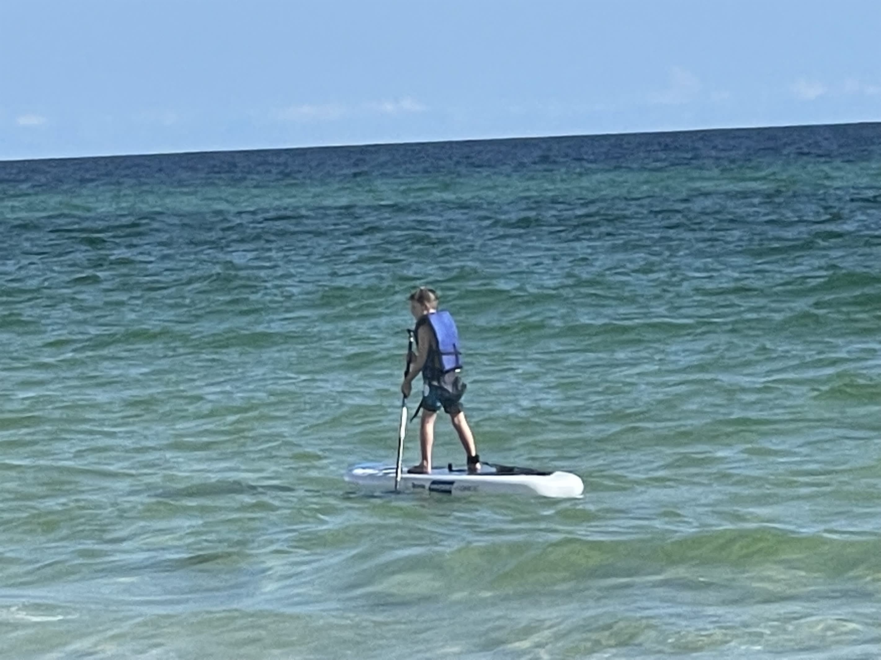 Rent a paddleboard and see the fish and manta rays up close.