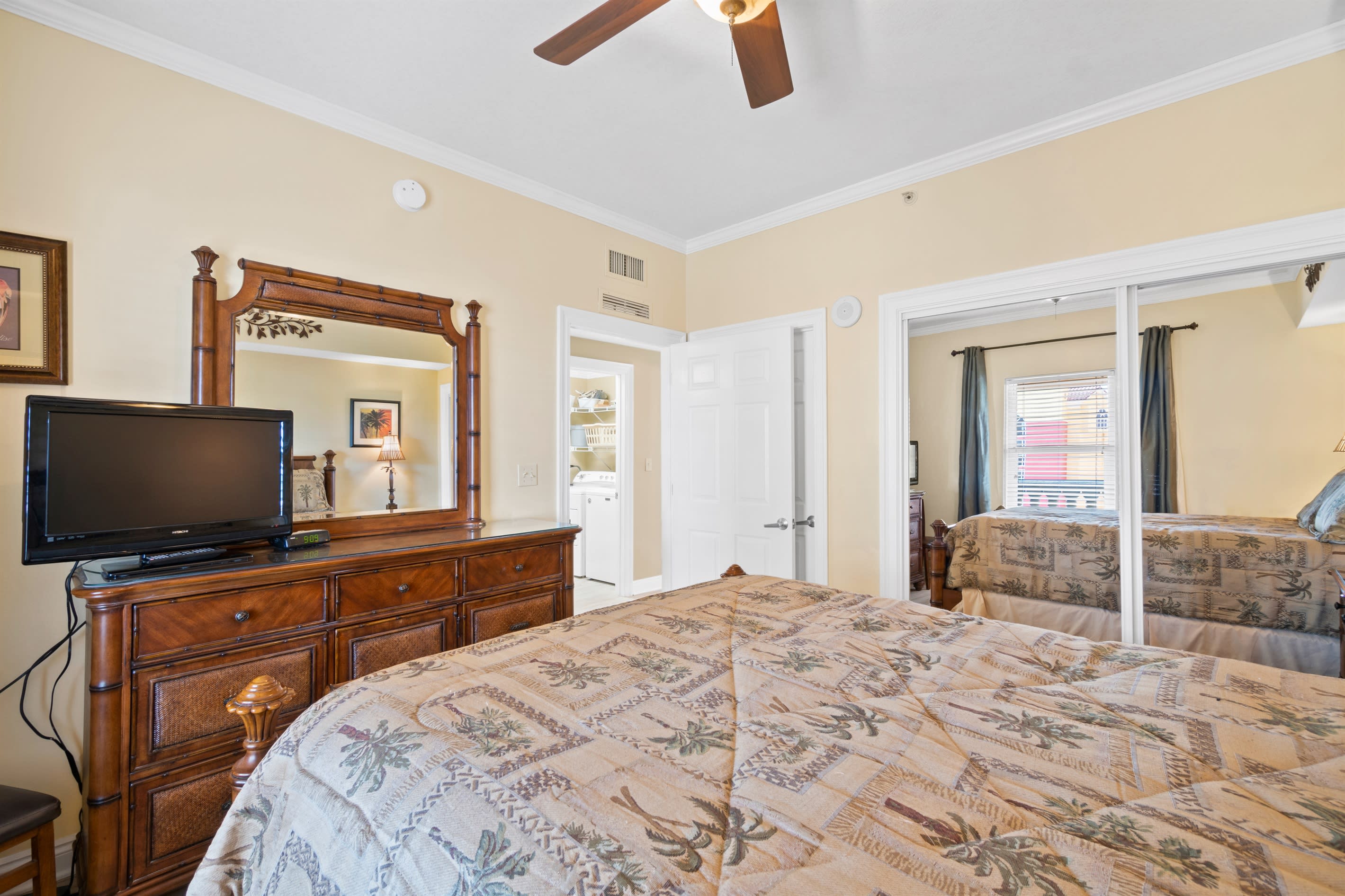 Queen bedroom with large closet and tv
