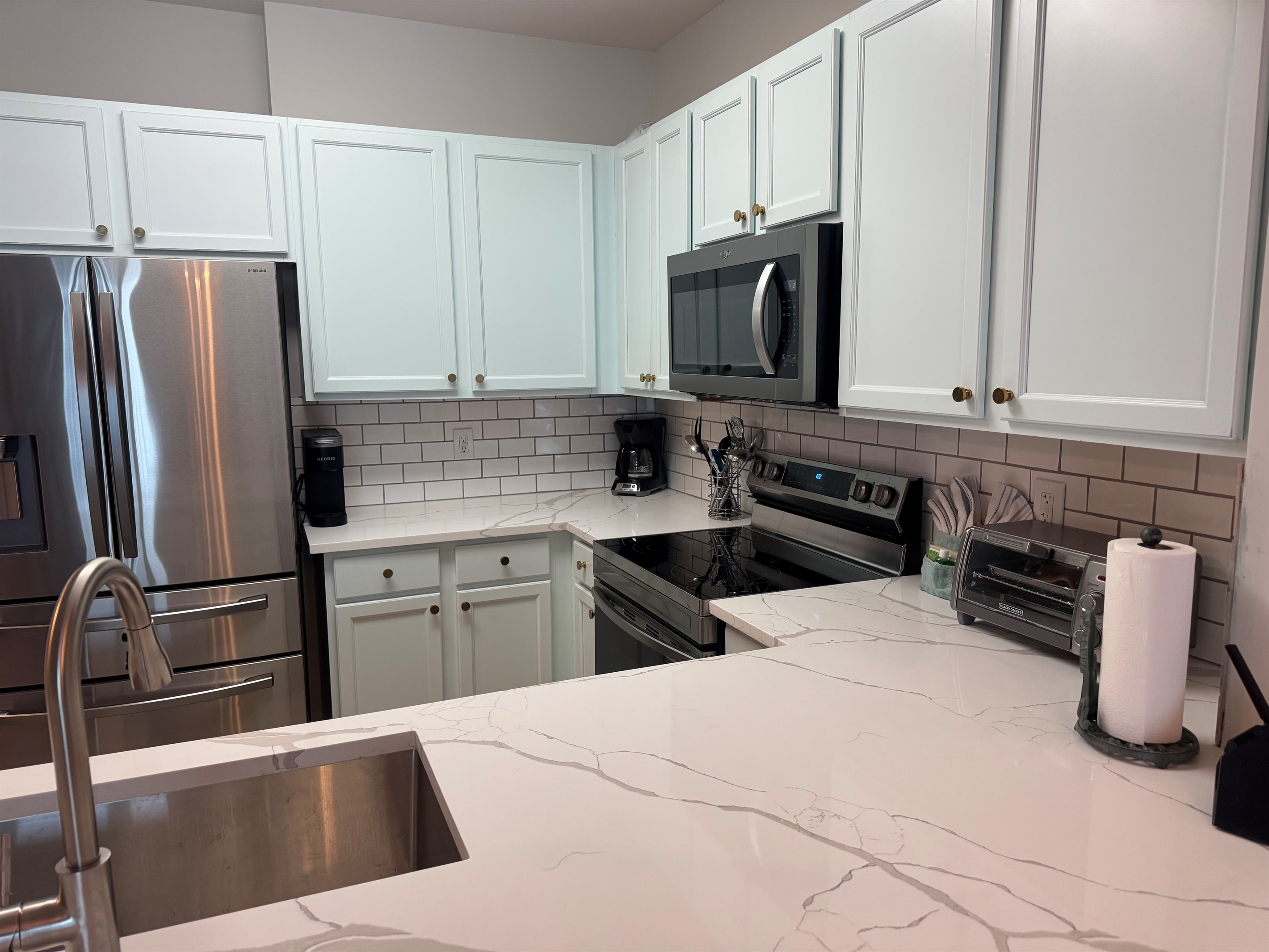 Appliances and countertops all new as of 2026. Toaster oven, coffee maker, Keurig, and all the pots, pans, and utensils you could possibly need.