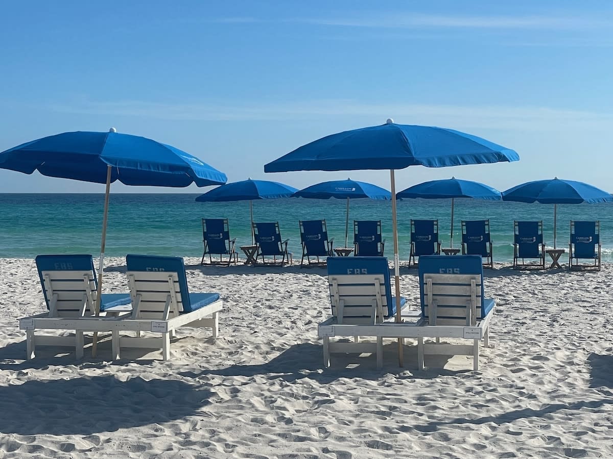 Daily beach setup - 8 wooden beach chairs and umbrellas. March thru October