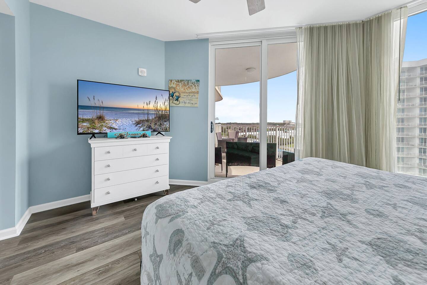 Relaxing bedroom retreat w/ TV, soft coastal colors, & direct access to the balcony Relaxing bedroom retreat w/ TV, soft coastal colors, & direct access to the balcony