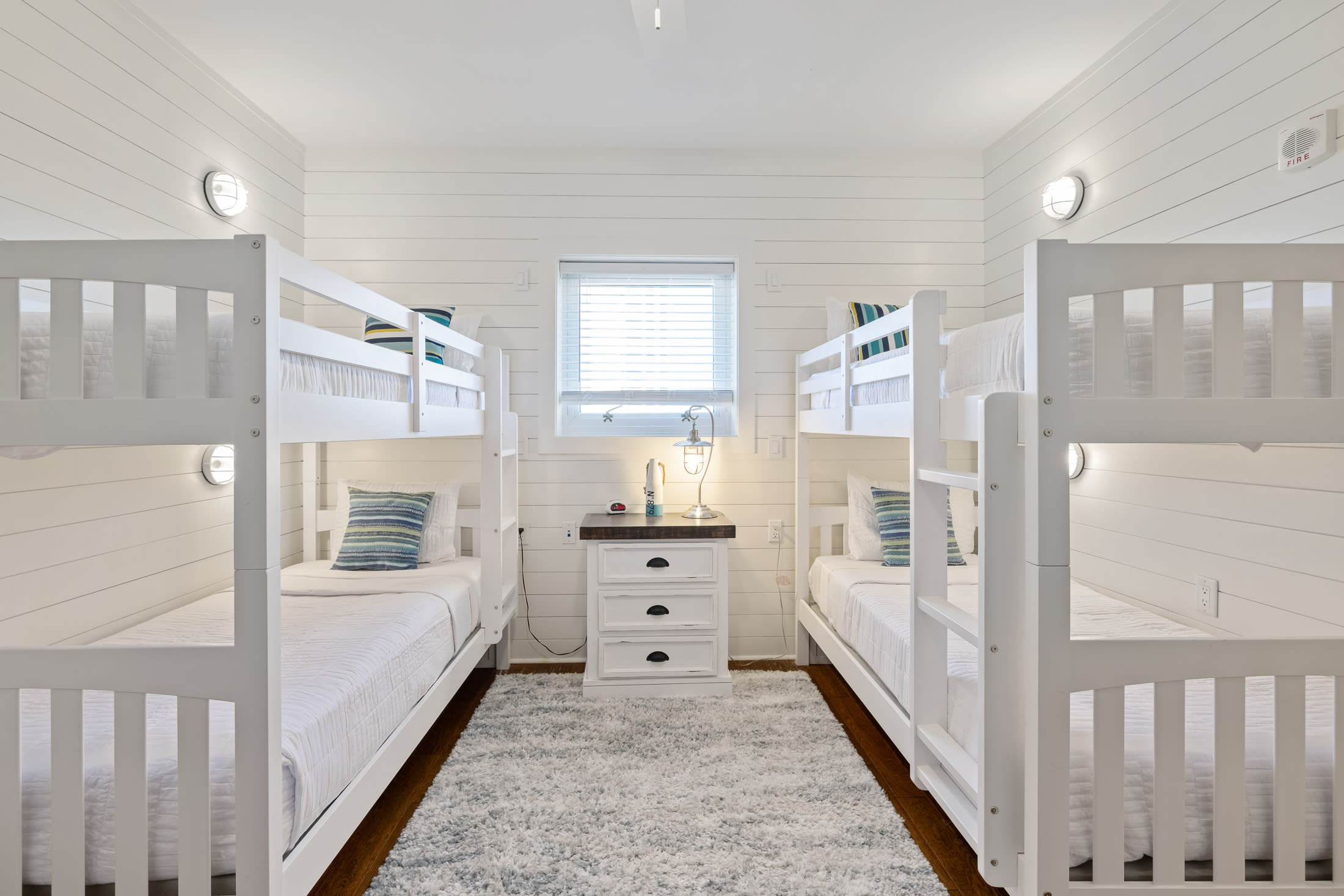 An awesome bunk room down with individual lights and charging at each bunk.